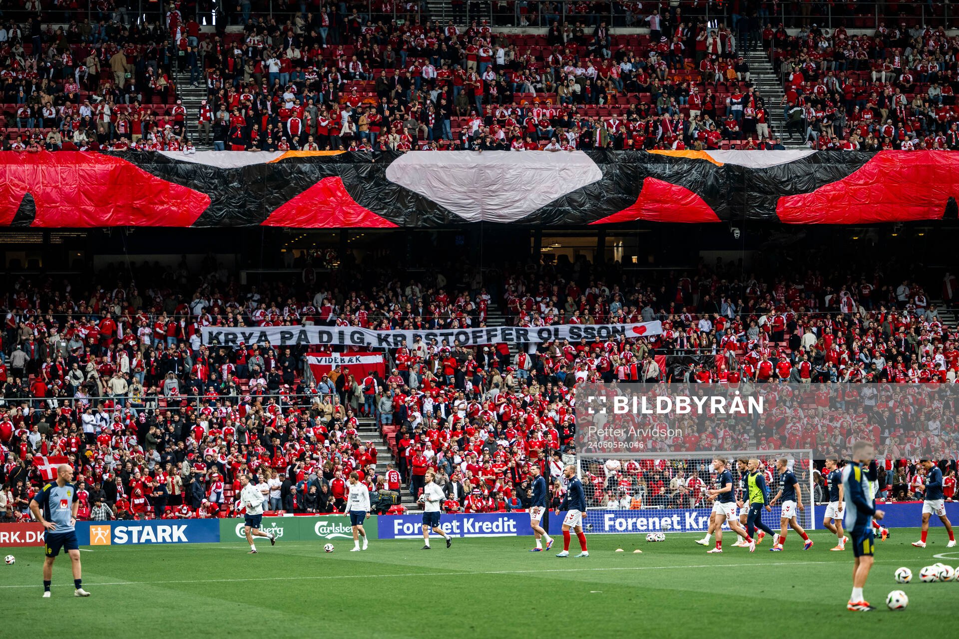 Fans of Denmark with a banner supporting Kristoffer Olsson
