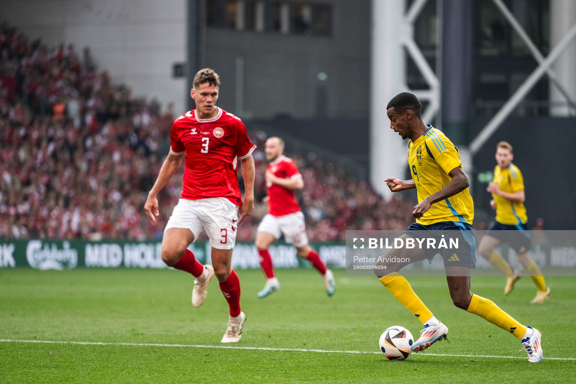 Jannik Vestergaard of Denmark and Alexander Isak of Sweden
