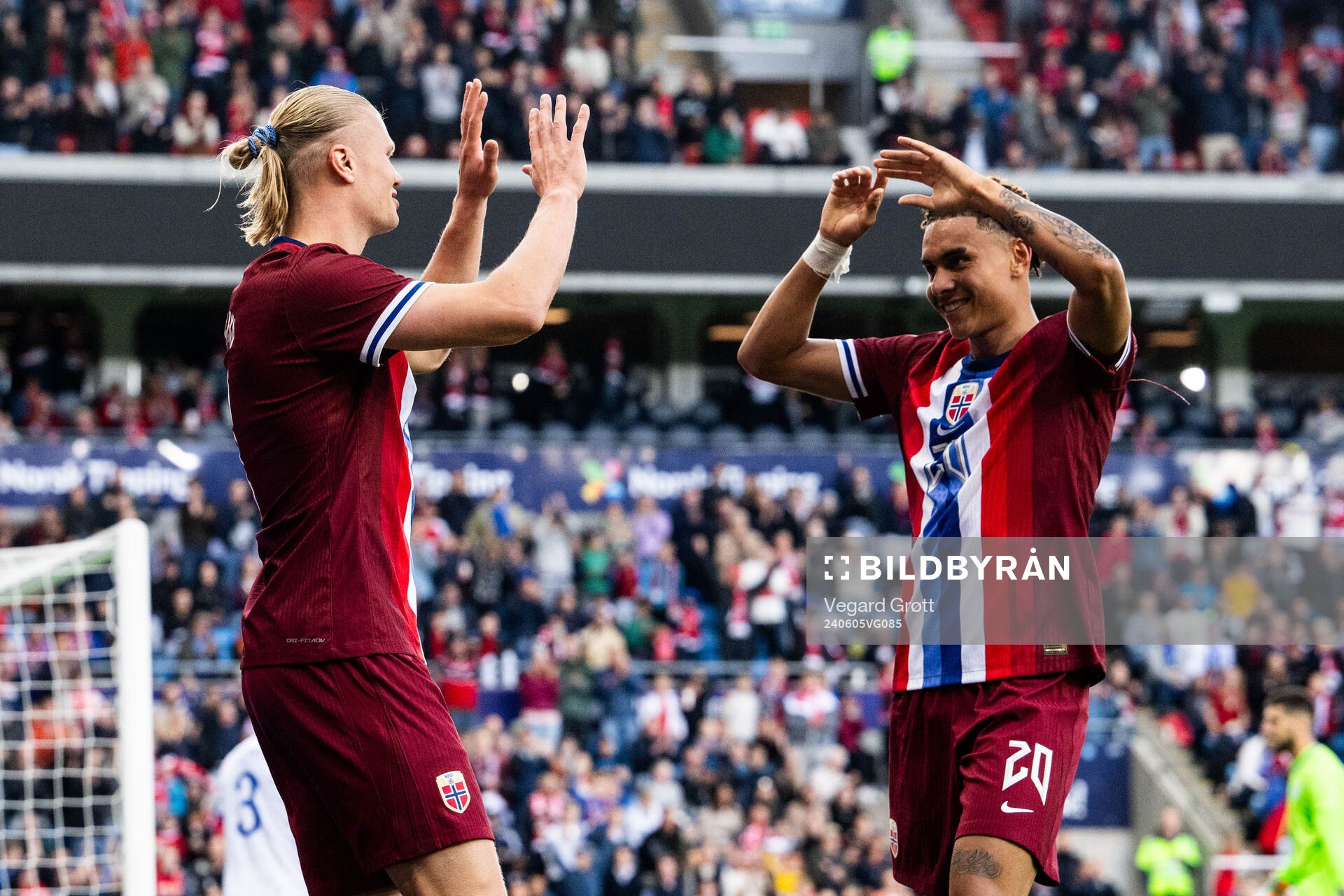 Erling Braut Haaland of Norway celebrates with Antonio Nusa