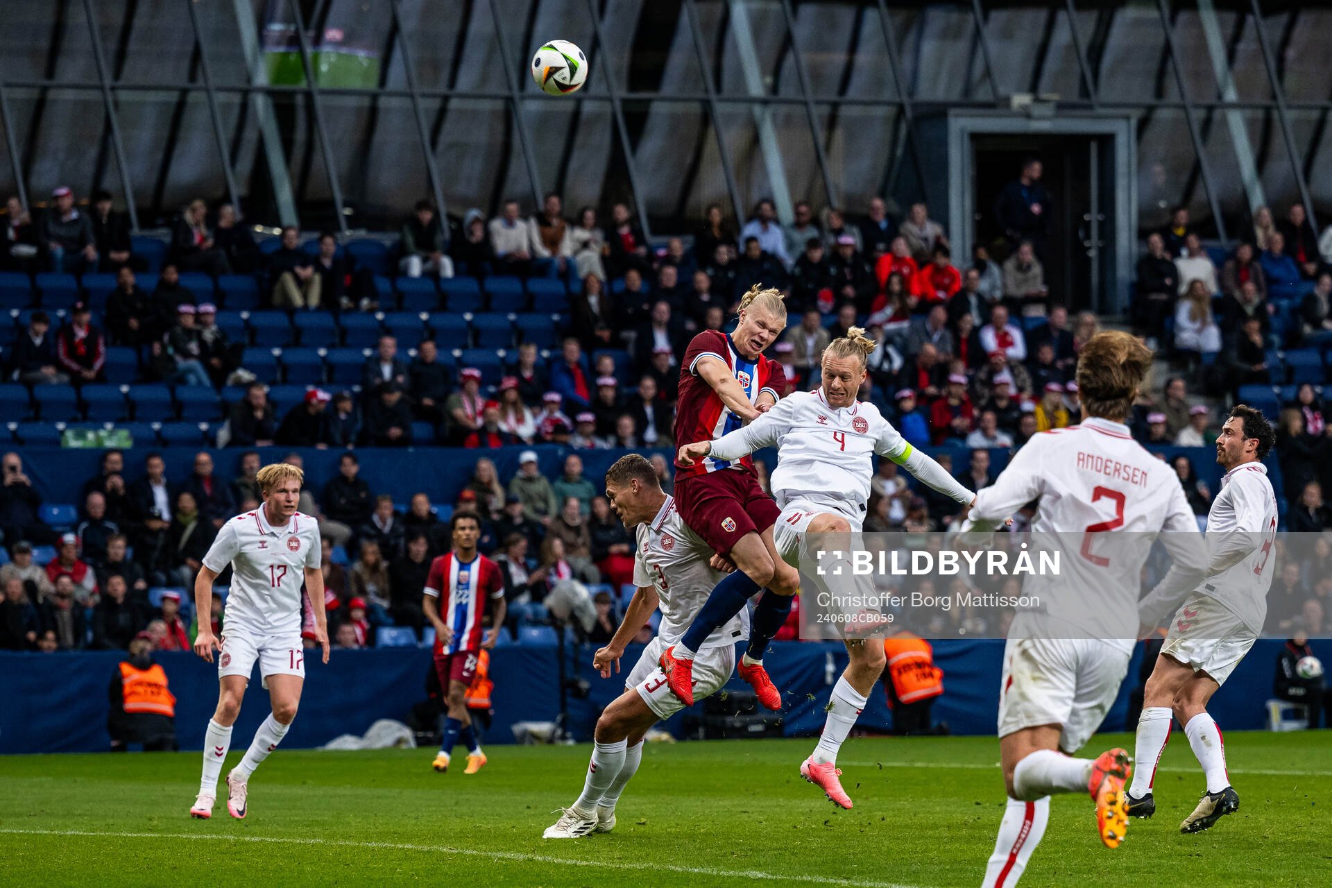Erling Braut Haaland of Norway and Simon Kjær of Denmark