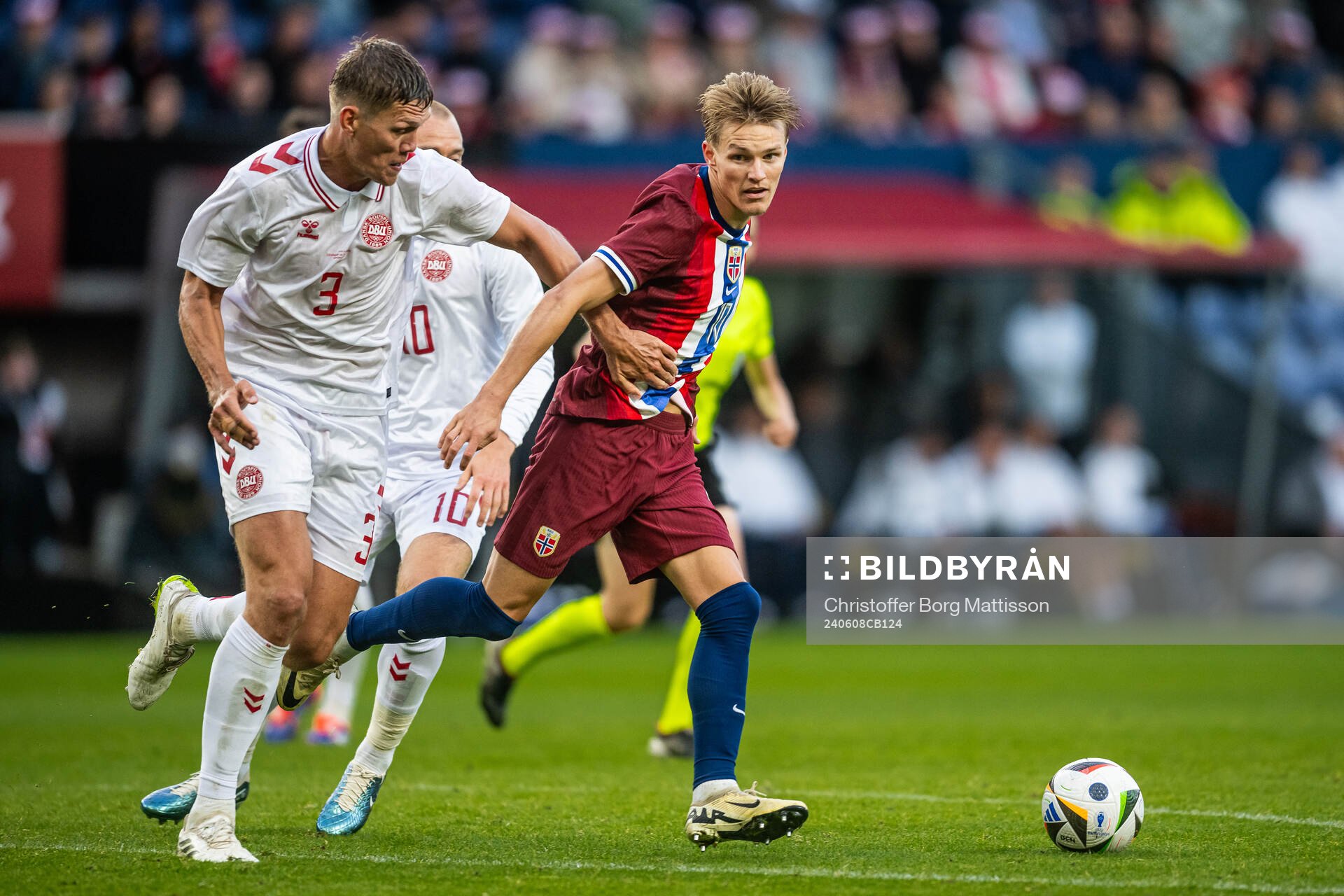 Jannik Vestergaard of Denmark and Martin Ødegaard of Norway