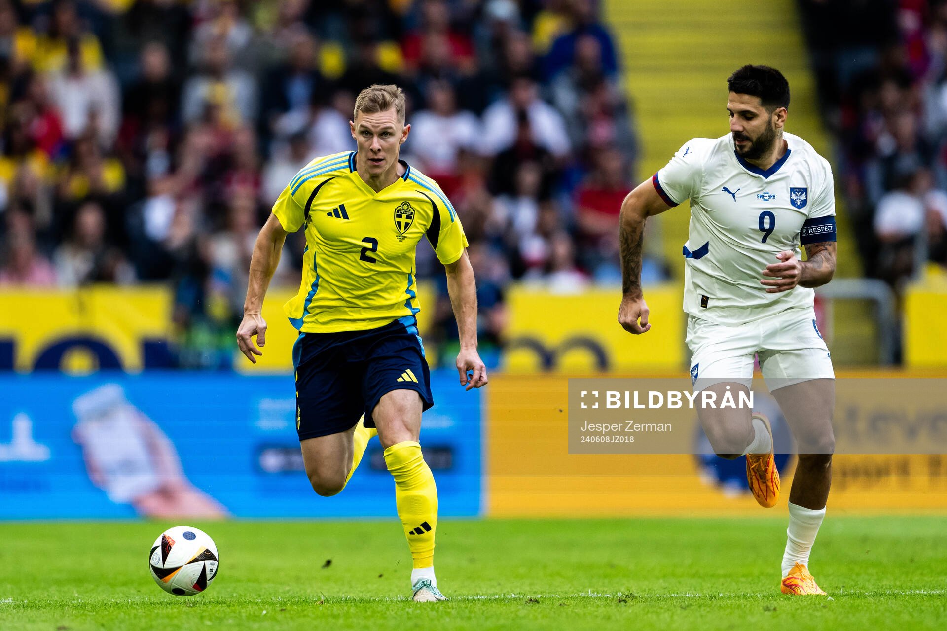 Emil Krafth of Sweden and Aleksandar Mitrovic of Serbia