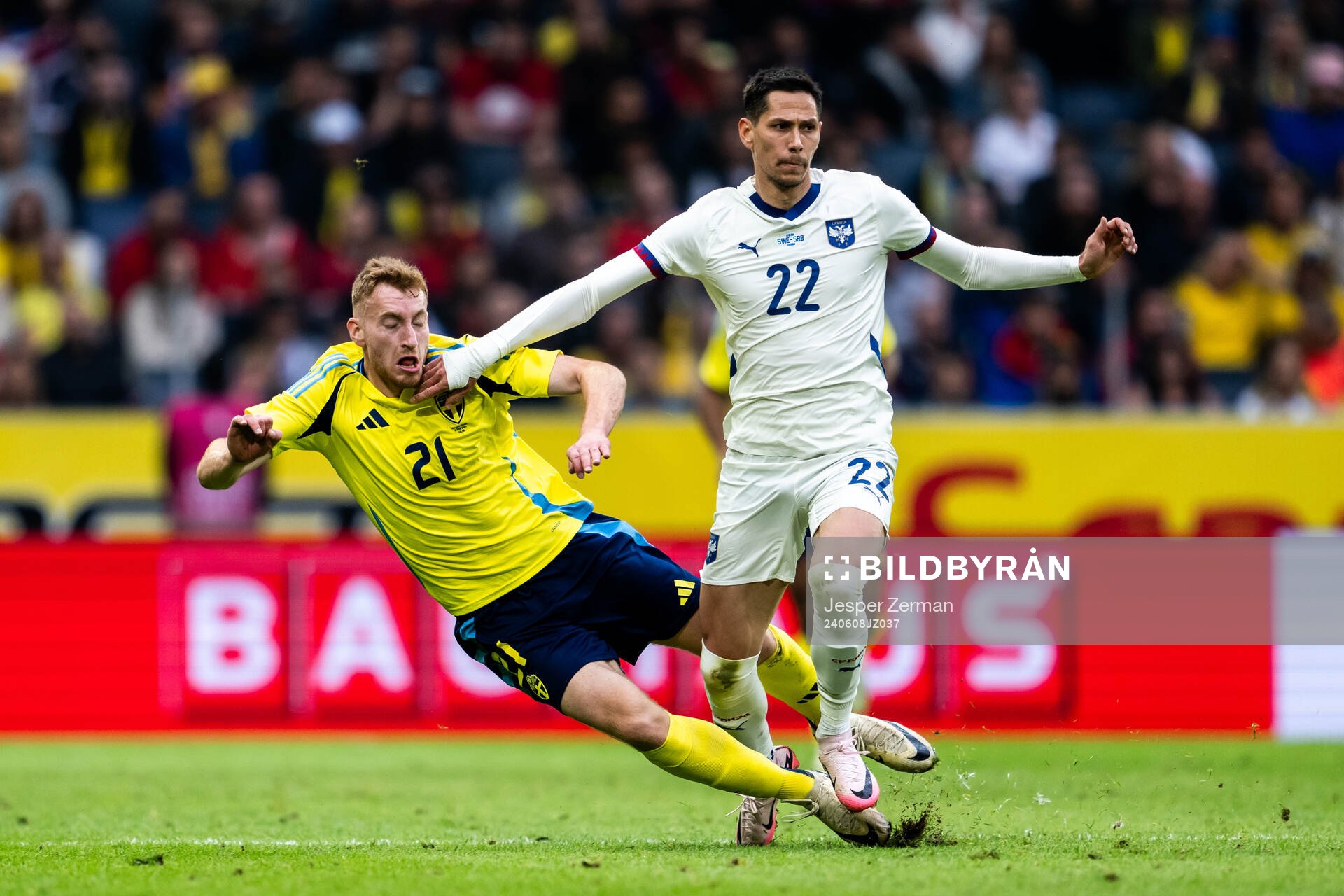 Dejan Kulusevski of Sweden and Sasa Lukic of Serbia