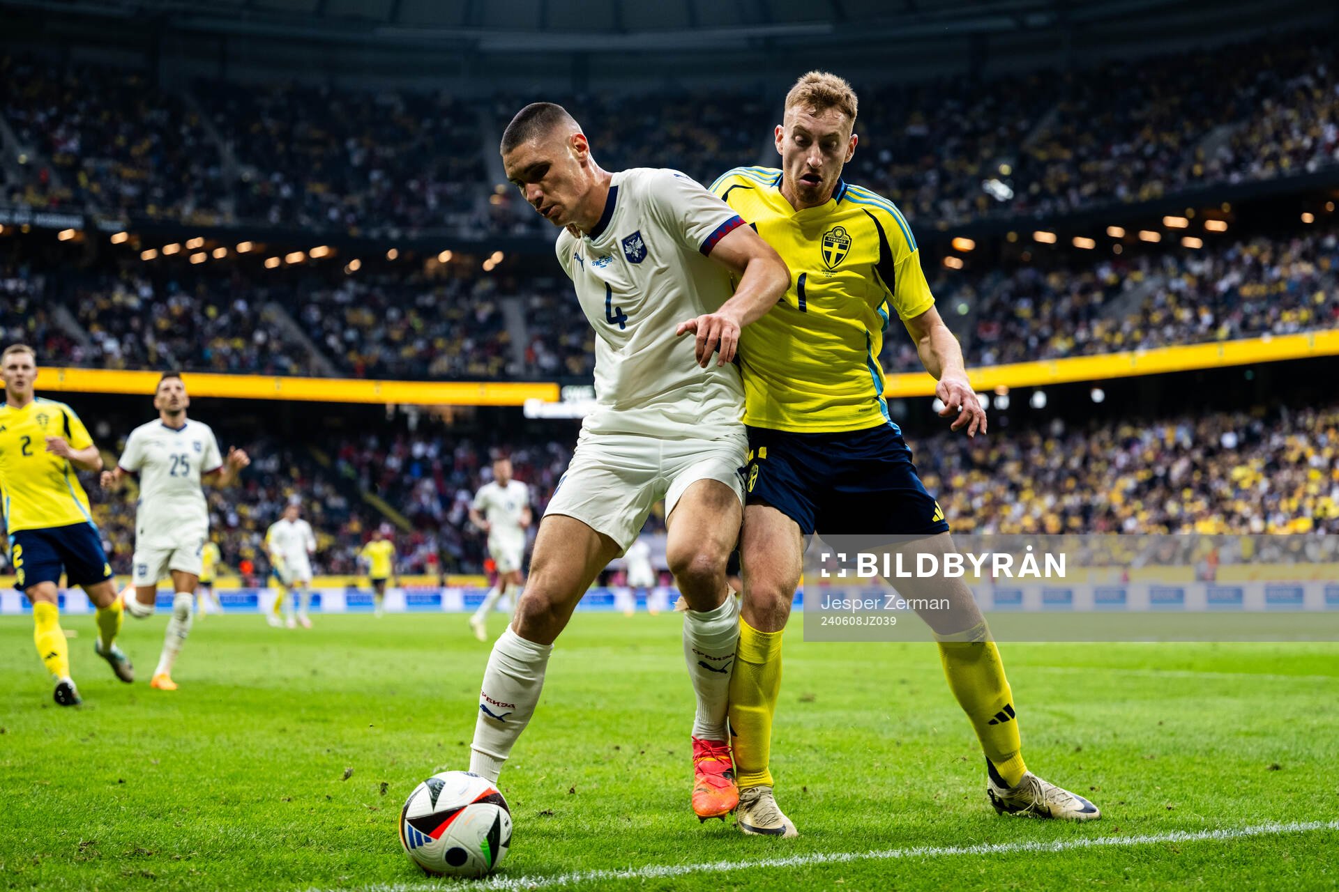 Nikola Milenkovic of Serbia and Dejan Kulusevski of Sweden