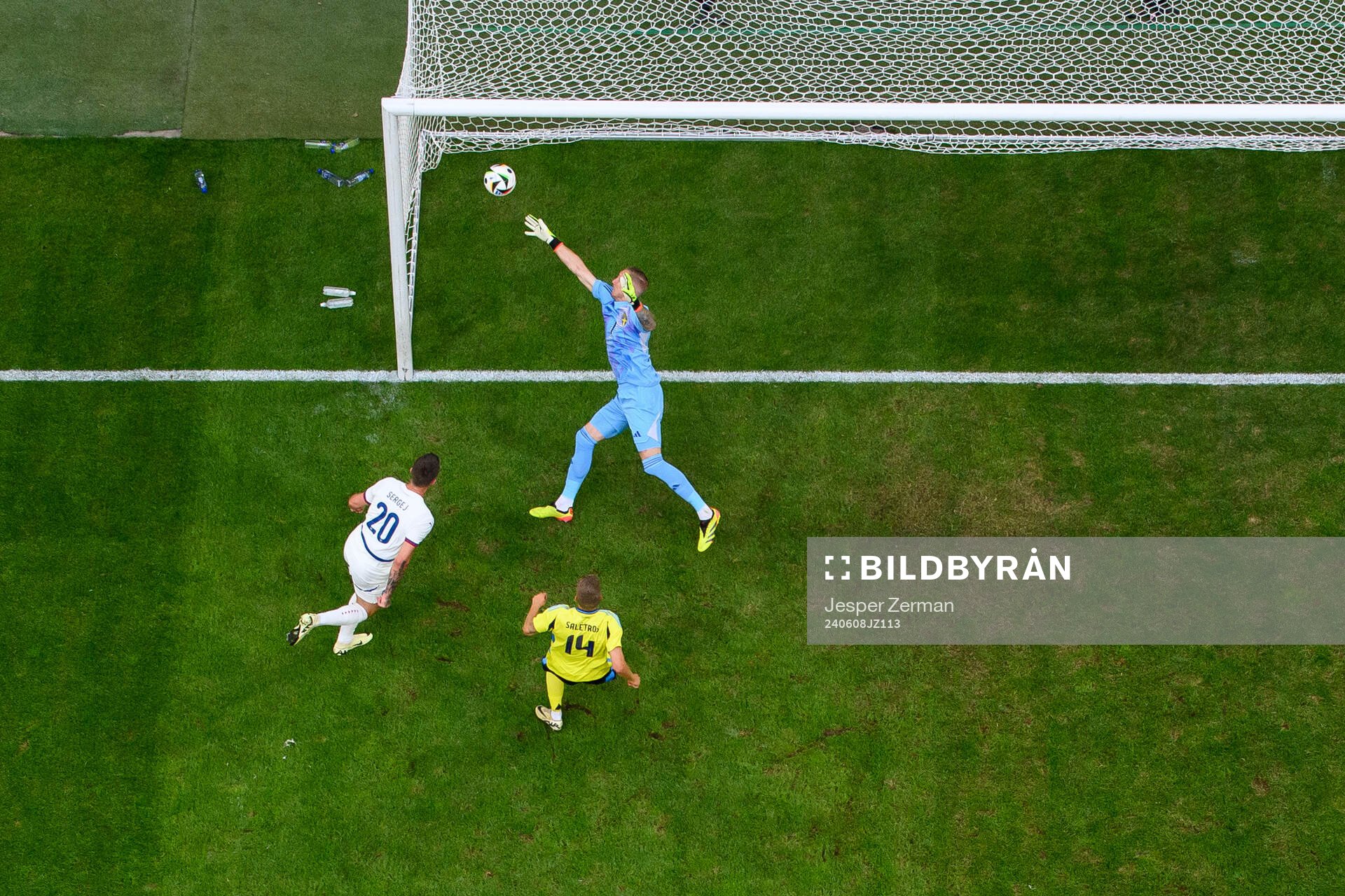 Sergej Milinkovic-Savic of Serbia scores 0-1 on goalkeeper Robin Olsen of Sweden during the international friendly football match between Sweden and Serbia on June 8, 2024 in Stockholm.