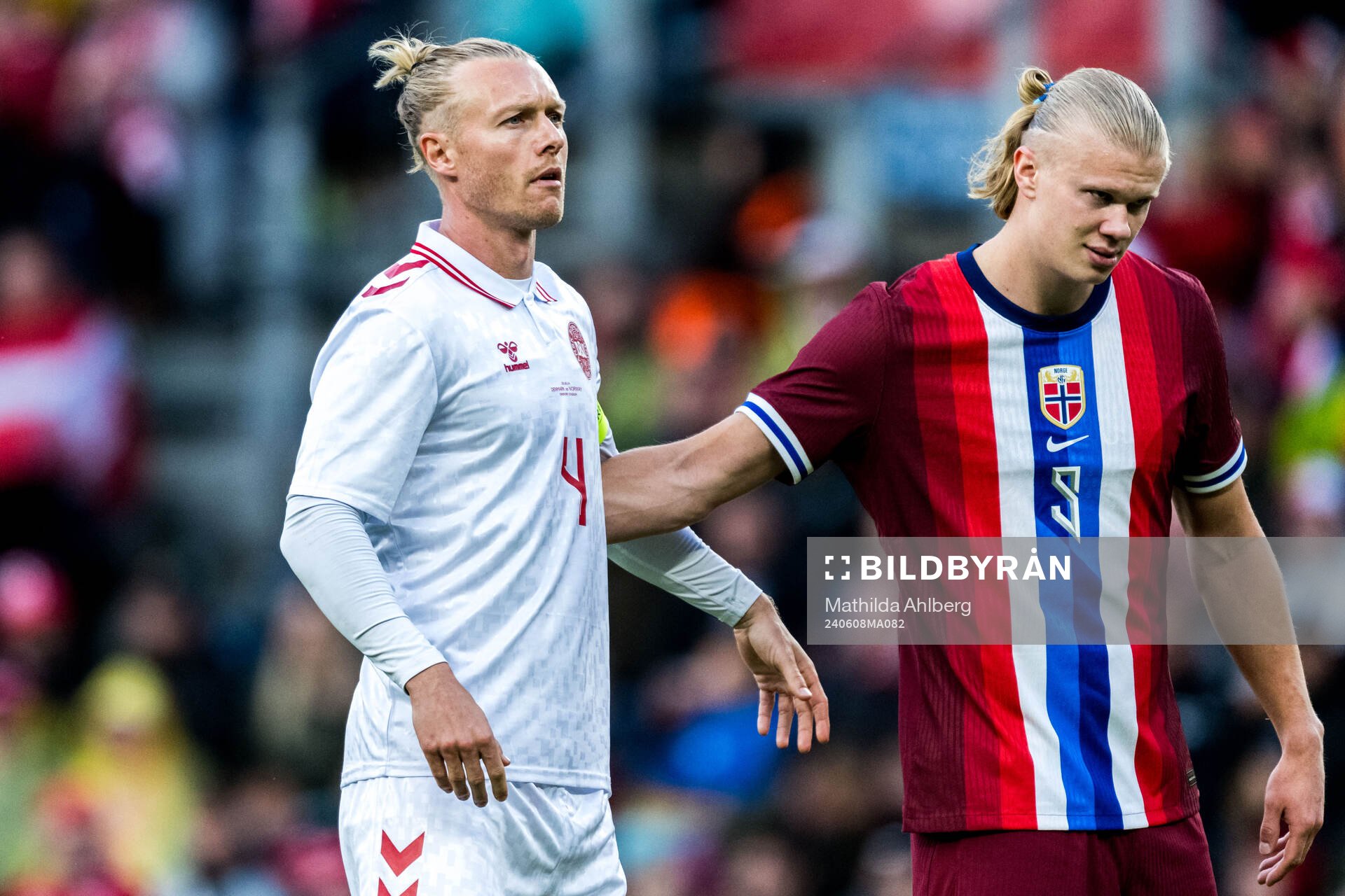 Simon Kjær of Denmark and Erling Braut Haaland of Norway