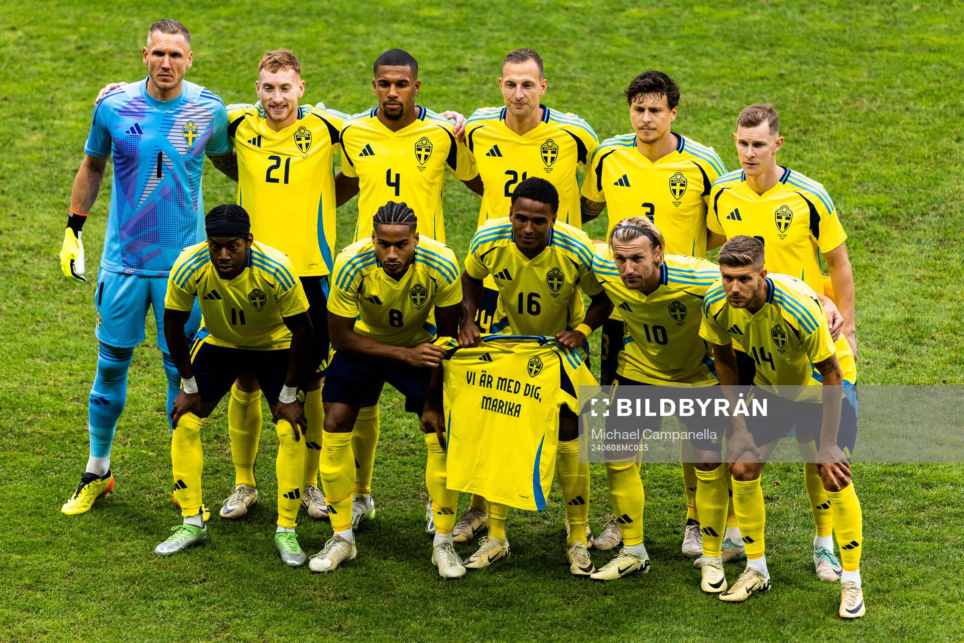 Players of Sweden line up for a team photo with a shirt