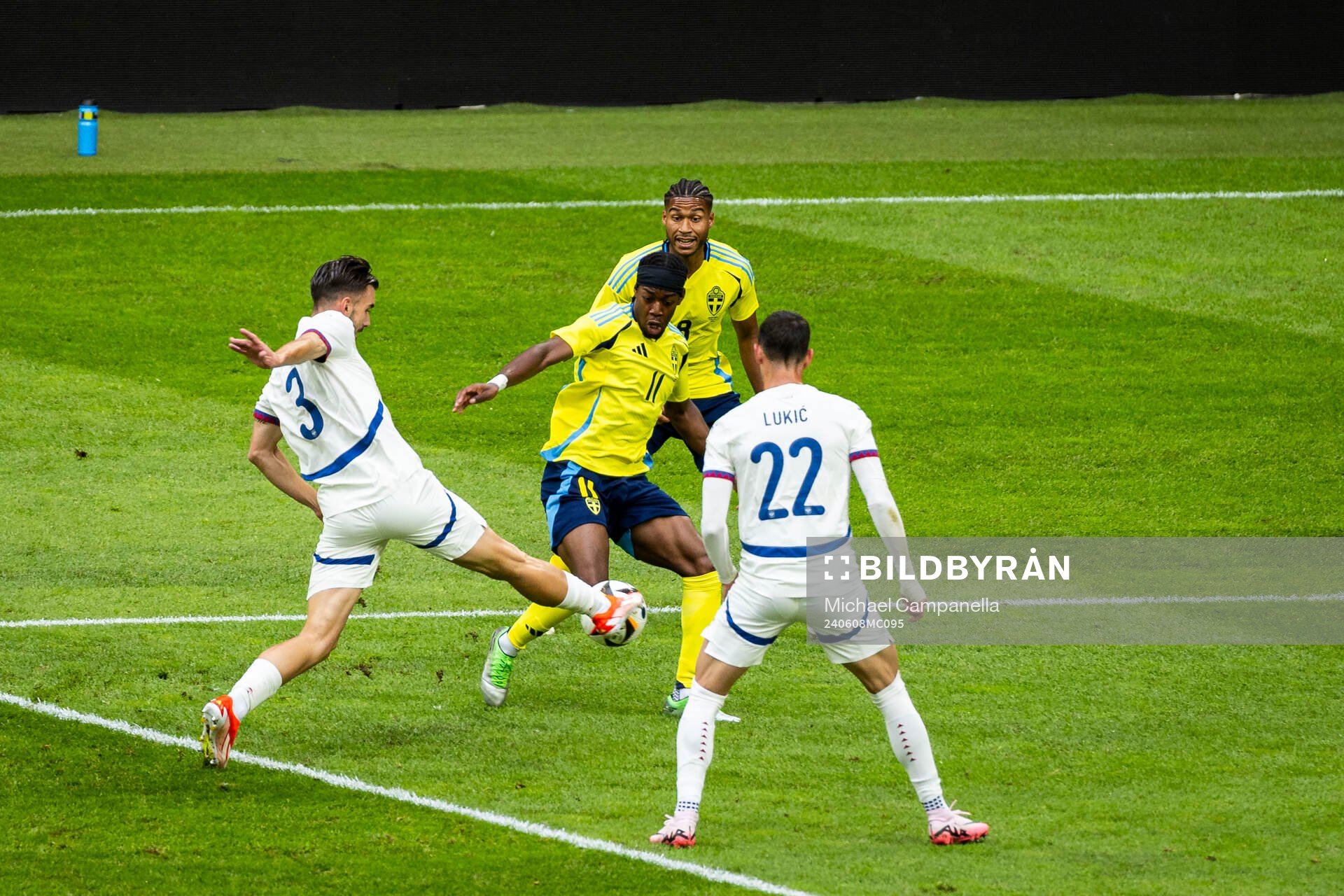 Anthony Elanga of Sweden against Sasa Lukic and Nemanja