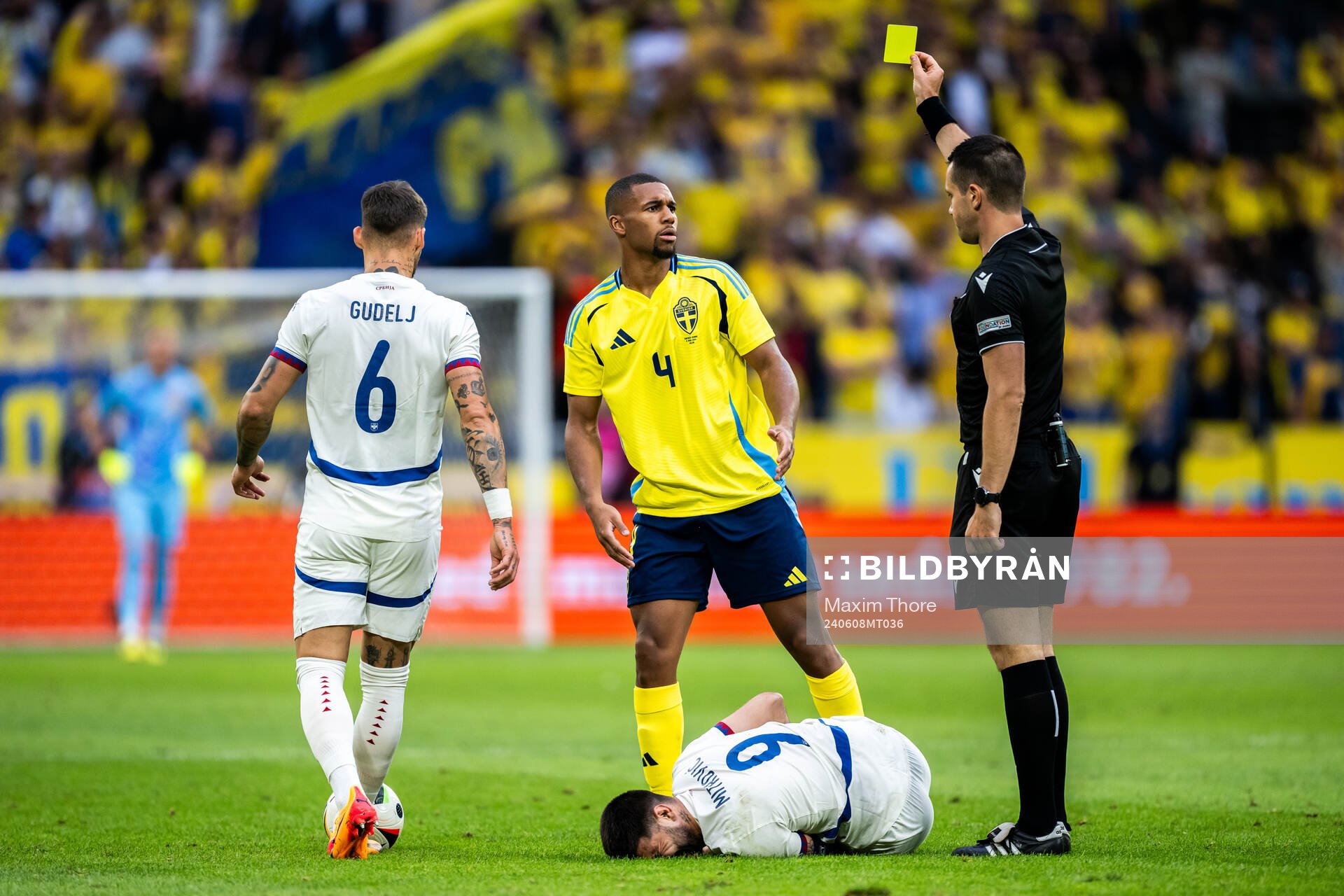 Isak Hien of Sweden receives a yellow card