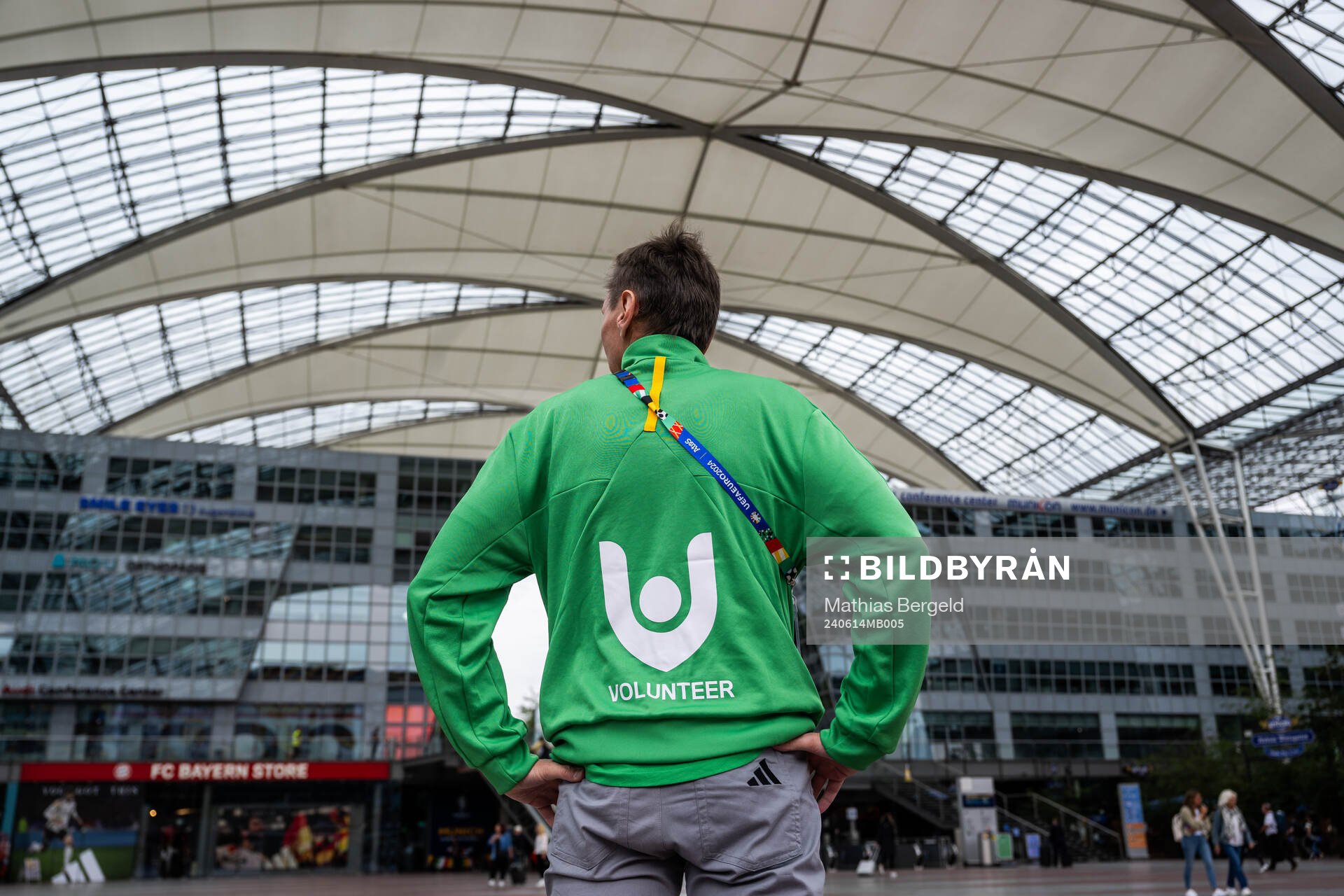 A volunteer is seen at Munich Airport