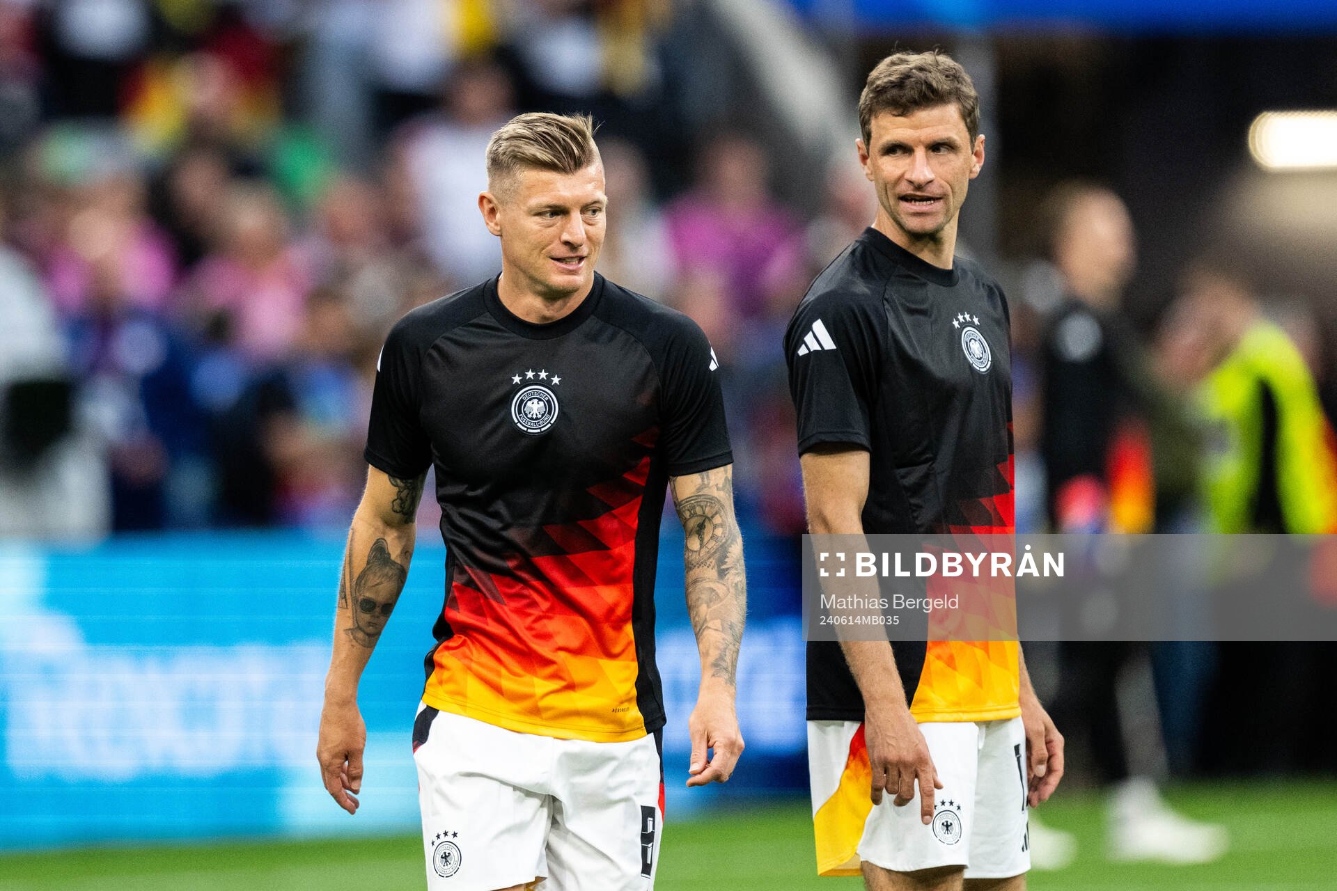 Toni Kroos and Thomas Müller of Germany