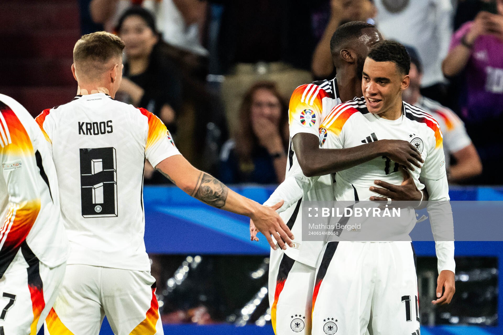 Jamal Musiala of Germany celebrates with Antonio Rüdiger