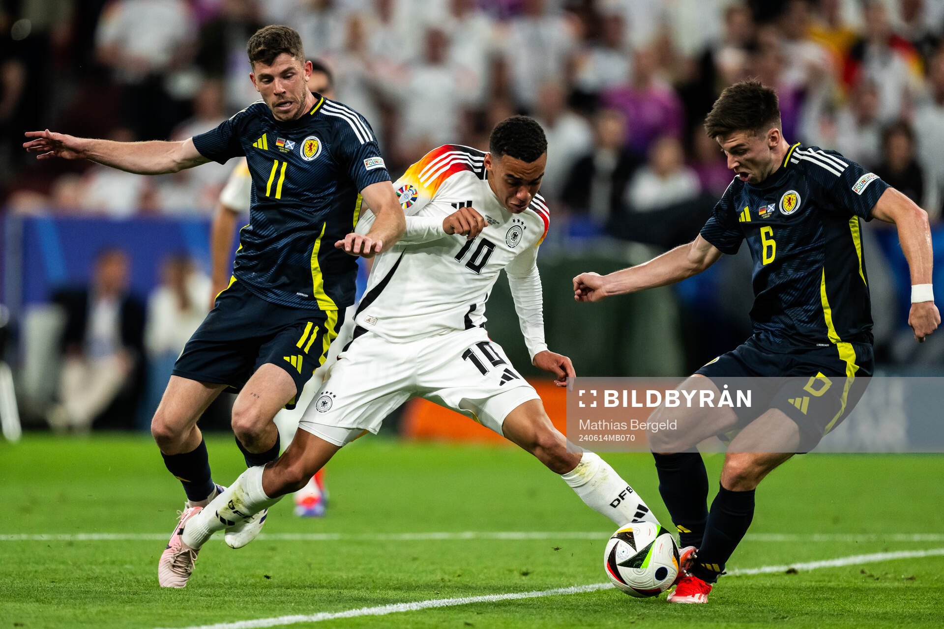 Ryan Christie and Kieran Tierney of Scotland against Jamal