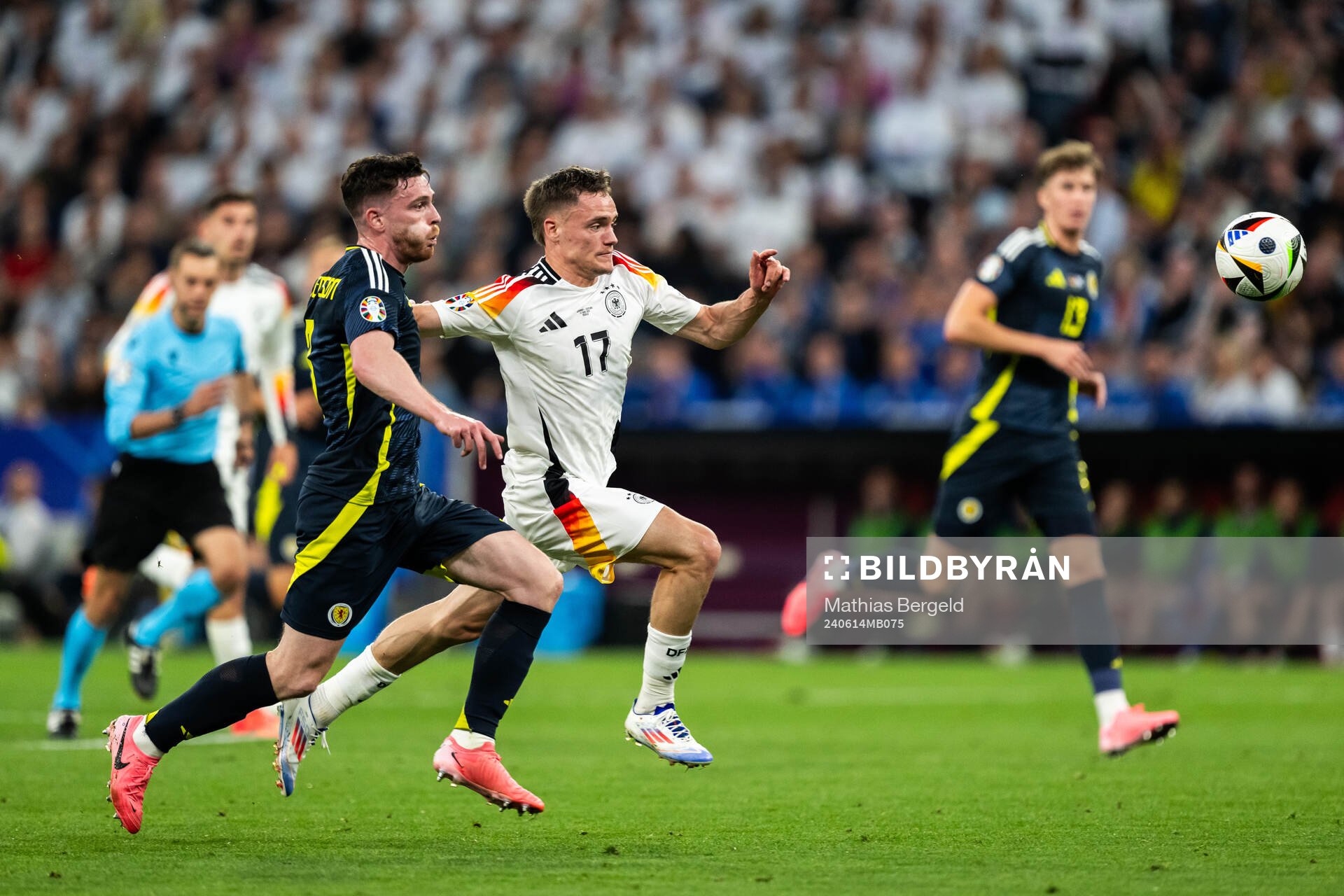 Andrew Robertson of Scotland and Florian Wirtz of Germany