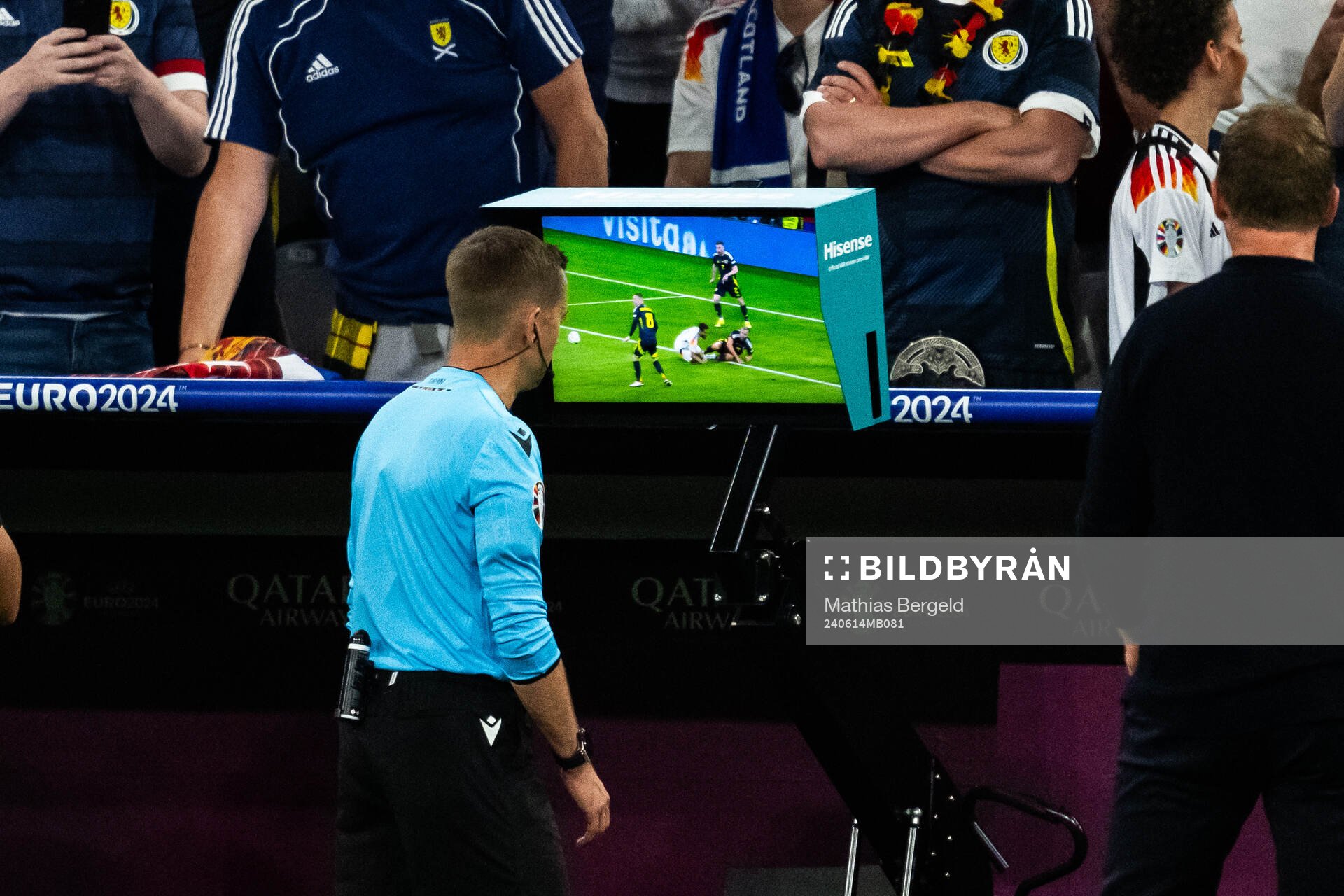 Referee Clément Turpin checks a screen