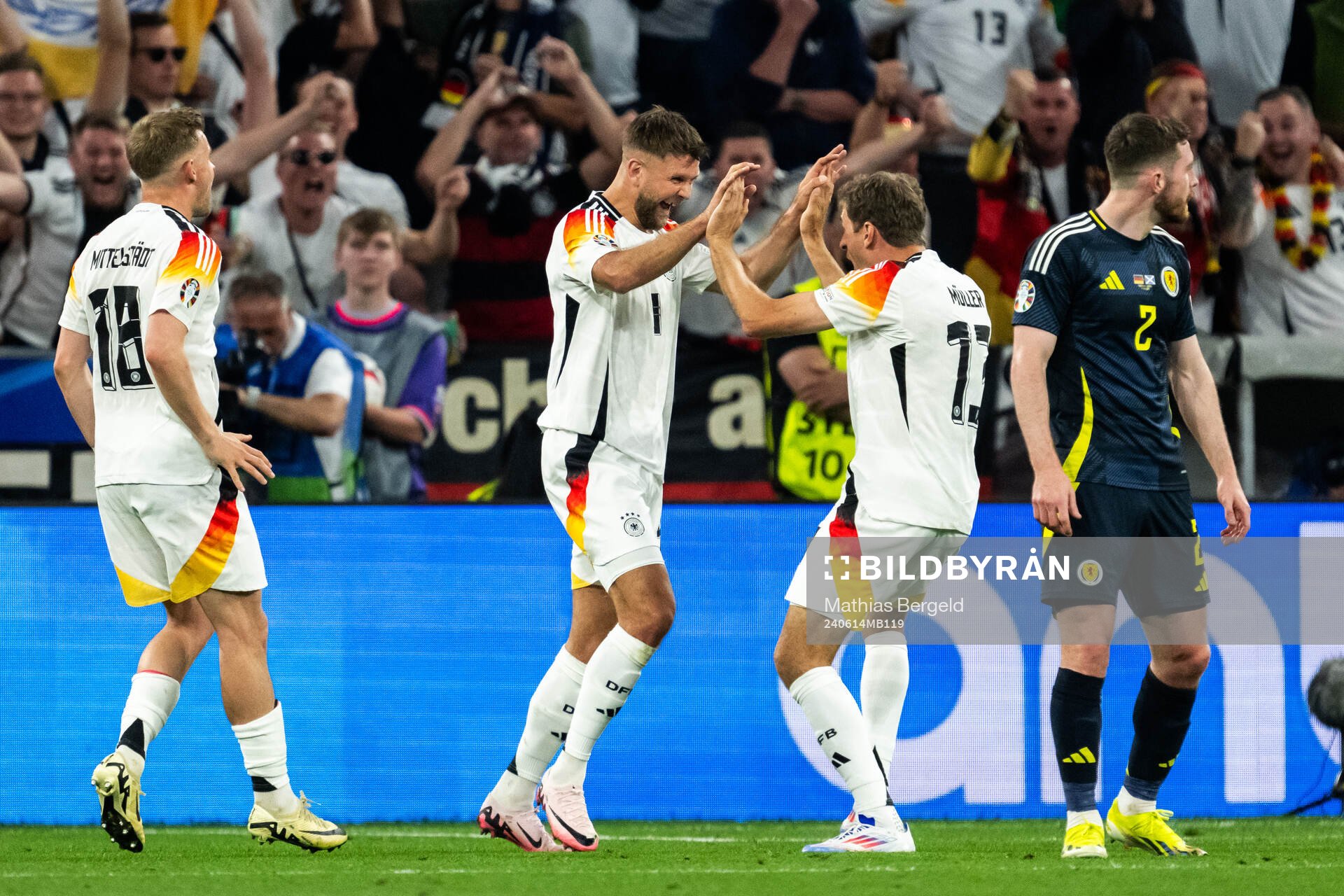 Niclas Füllkrug of Germany celebrate with Thomas Müller