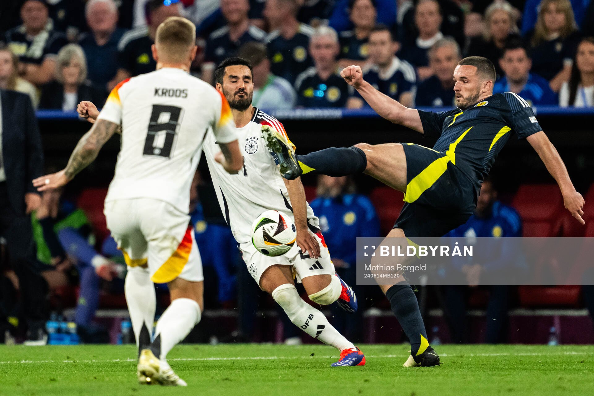 Ilkay Gündogan of Germany and John McGinn of Scotland