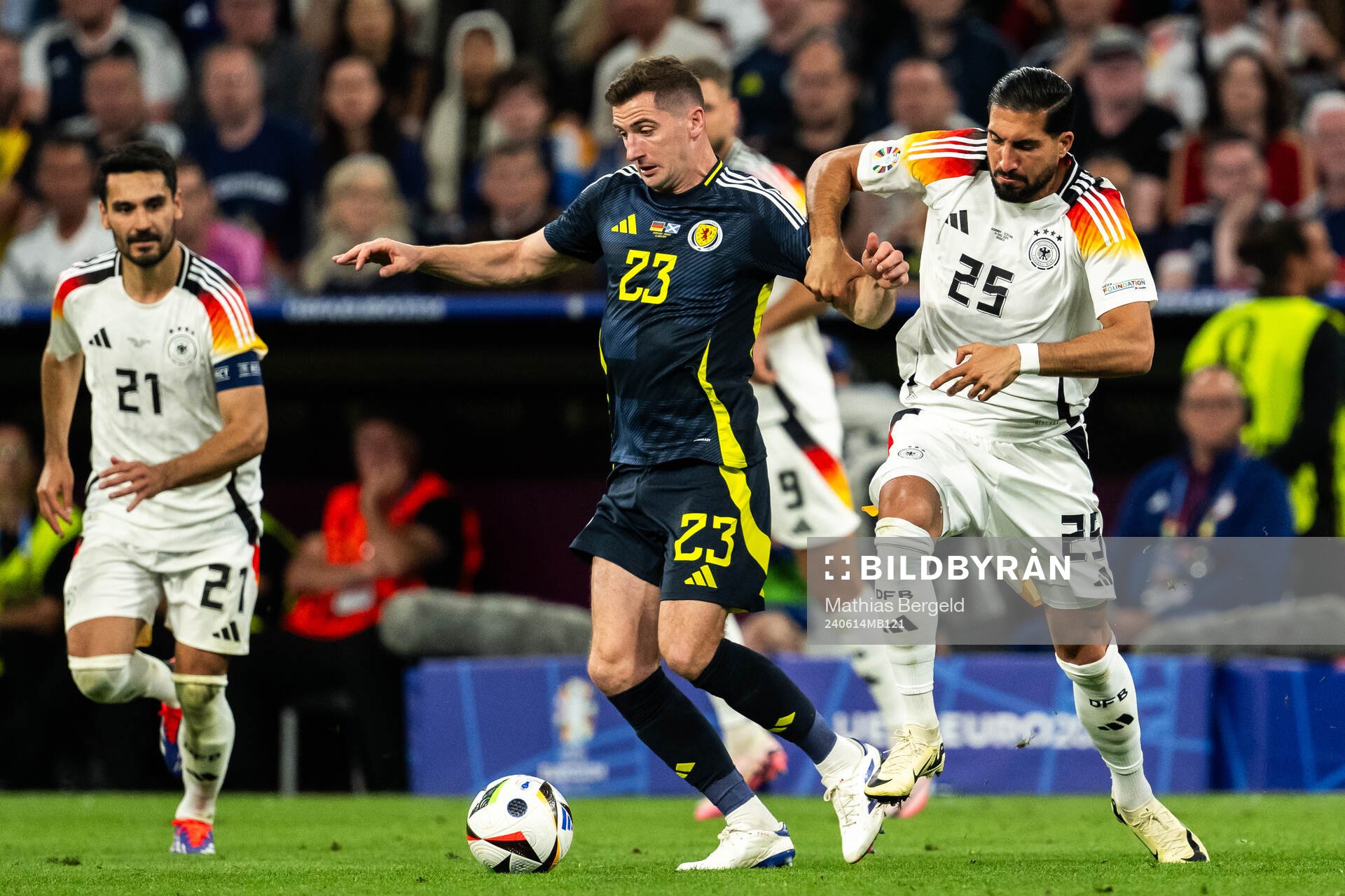 Kenny McLean of Scotland and Emre Can of Germany