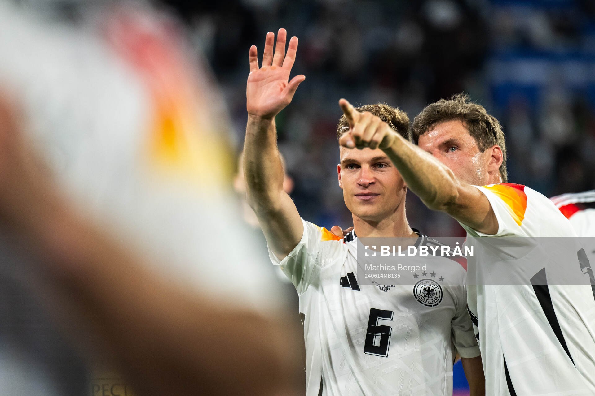 Joshua Kimmich and Thomas Müller of Germany celebrate