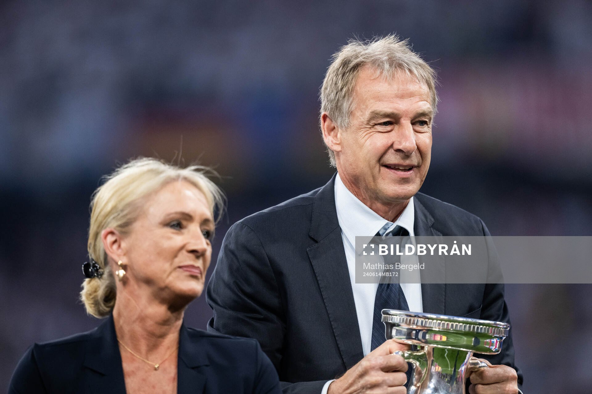 Heidi Beckenbauer and Jürgen Klinsmann with the Henri Delaunay Cup trophy as they honour the late Franz Beckenbauer ahead of the UEFA Euro 2024 Football Championship match between Germany and Scotland on June 14, 2024 in Munich. 
