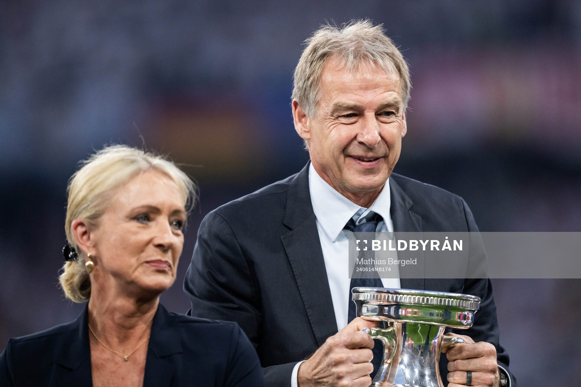 Heidi Beckenbauer and Jürgen Klinsmann with the Henri Delaunay Cup trophy as they honour the late Franz Beckenbauer ahead of the UEFA Euro 2024 Football Championship match between Germany and Scotland on June 14, 2024 in Munich.
