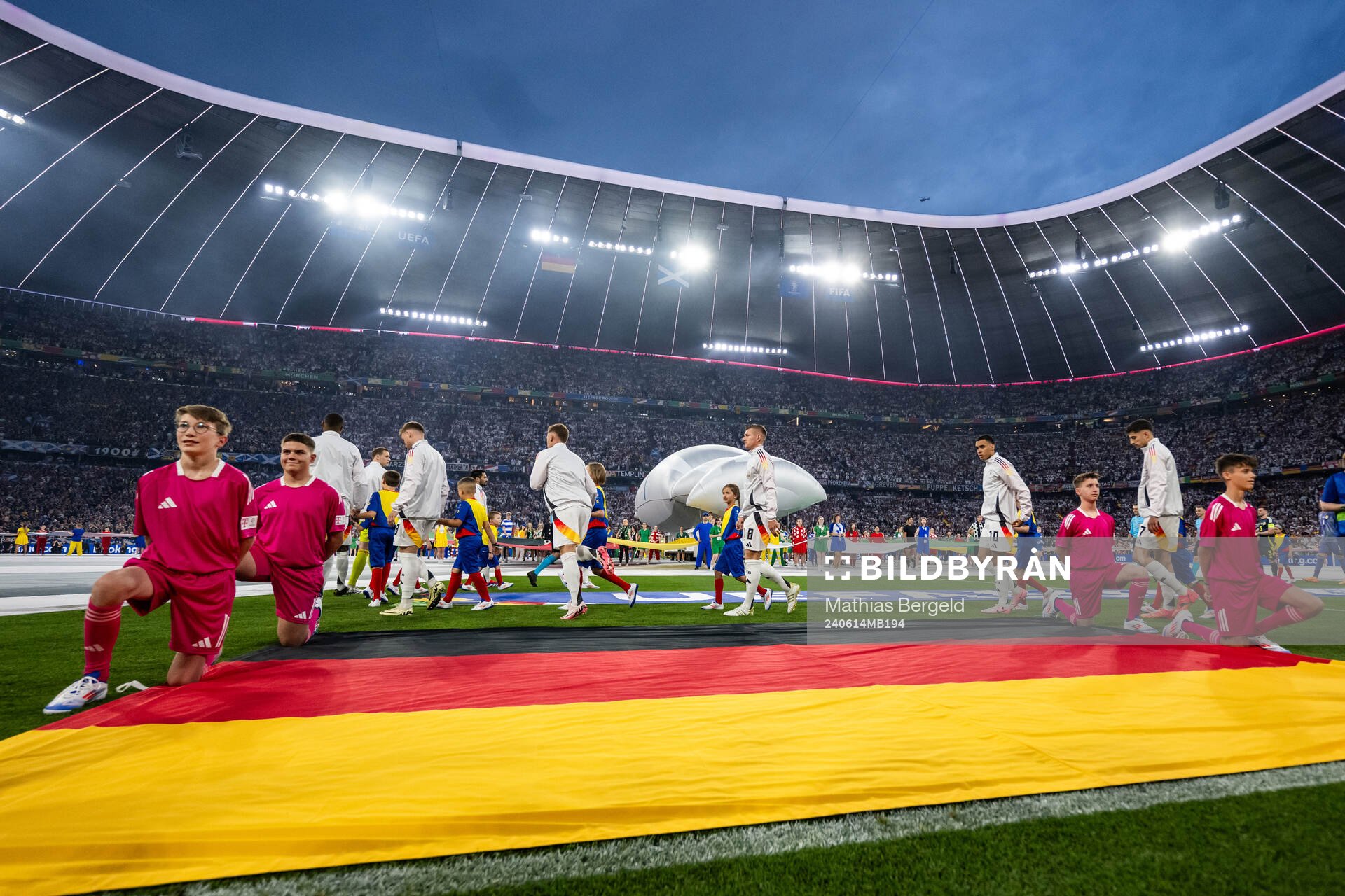Toni Kroos and Jamal Musiala of Germany enter the pitch