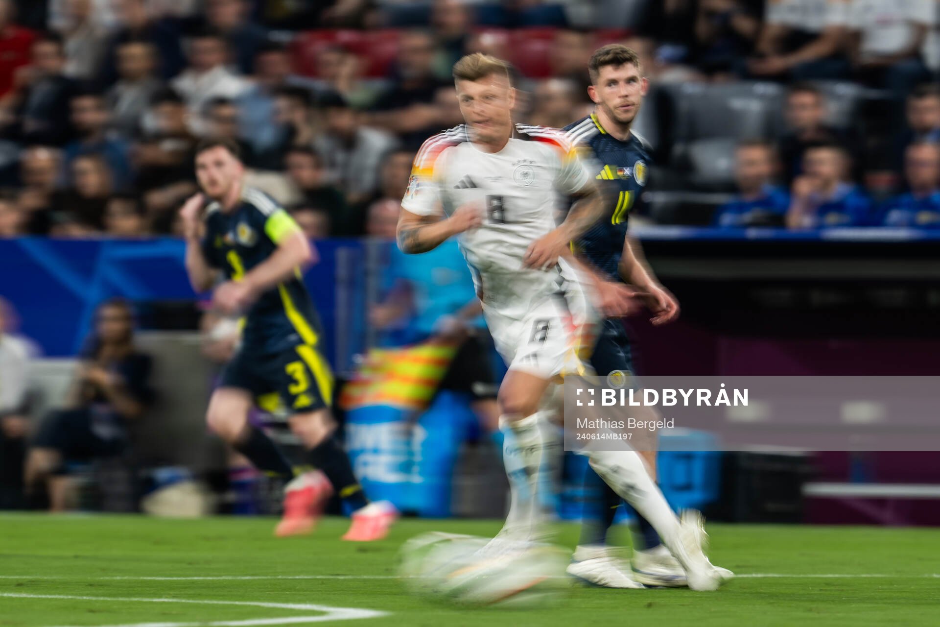 Toni Kroos of Germany and Ryan Christie of Scotland