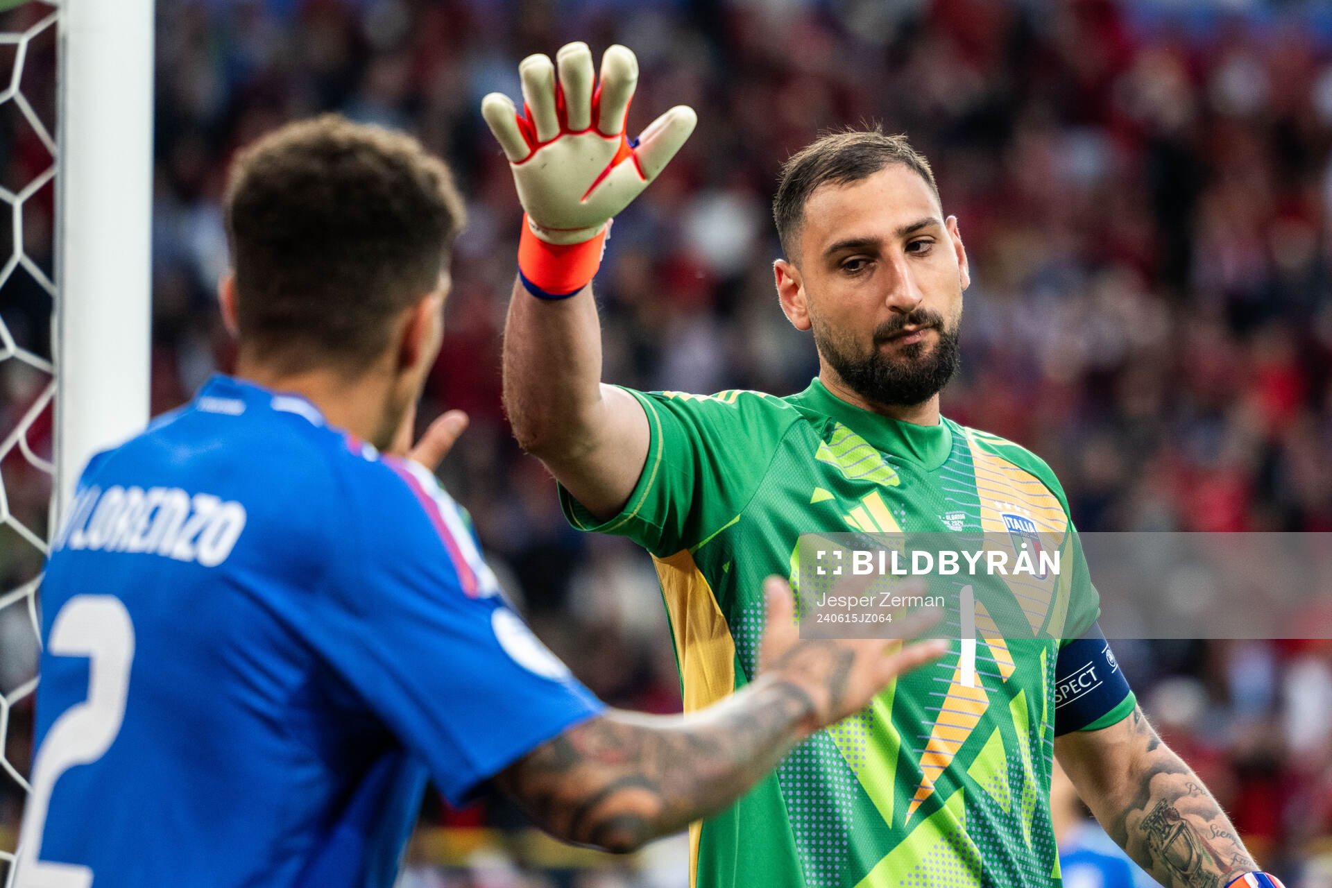 Giovanni Di Lorenzo and goalkeeper Gianluigi Donnarumma of