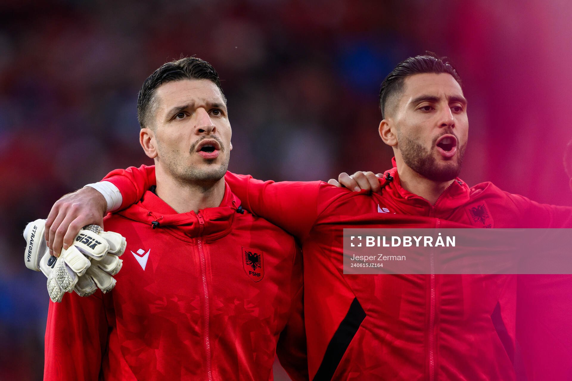 Medon Berisha and goalkeeper Thomas Strakosha of Albania