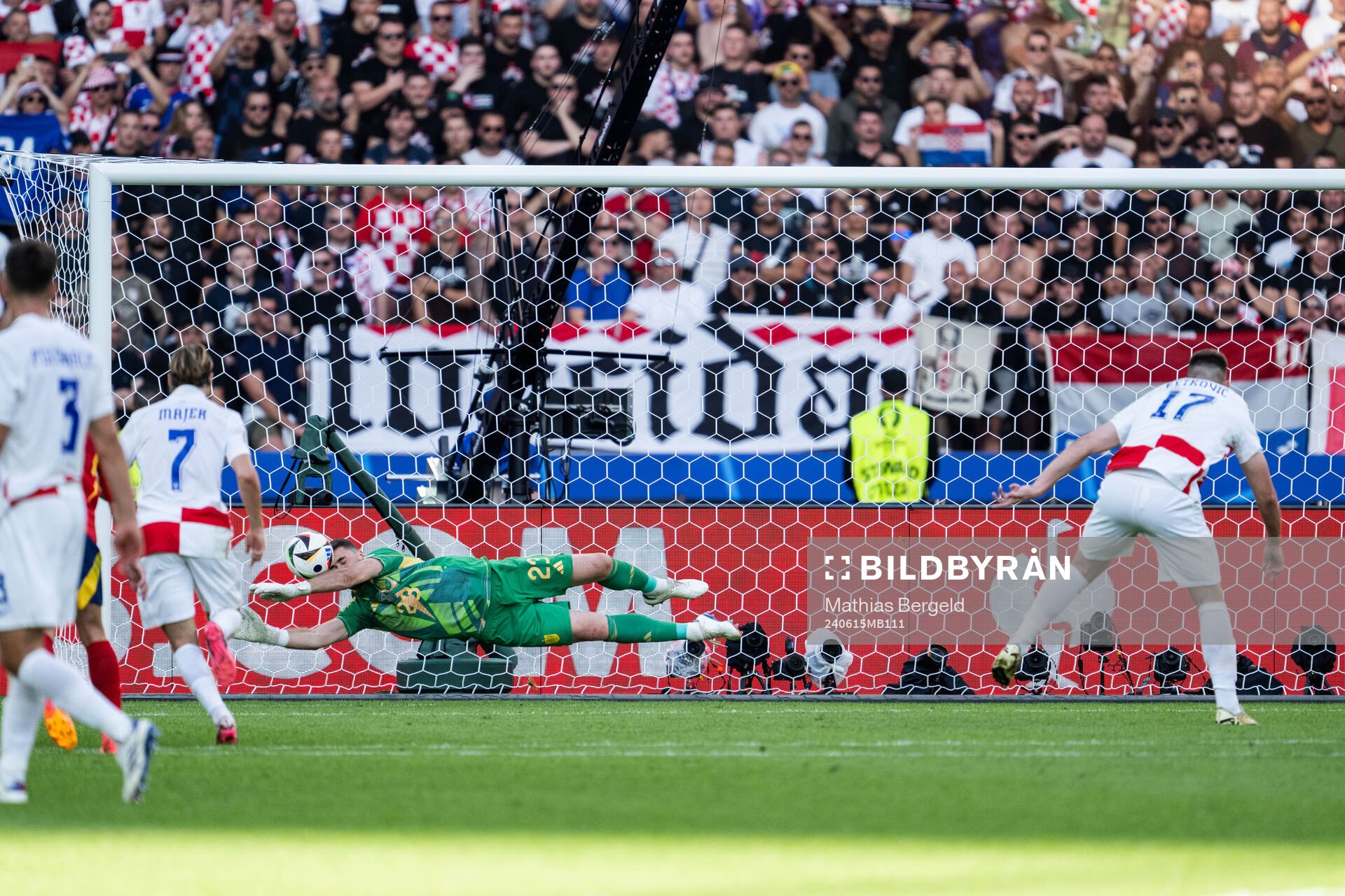 Goalkeeper Unai Simon Mendibil of Spain saves penalty by
