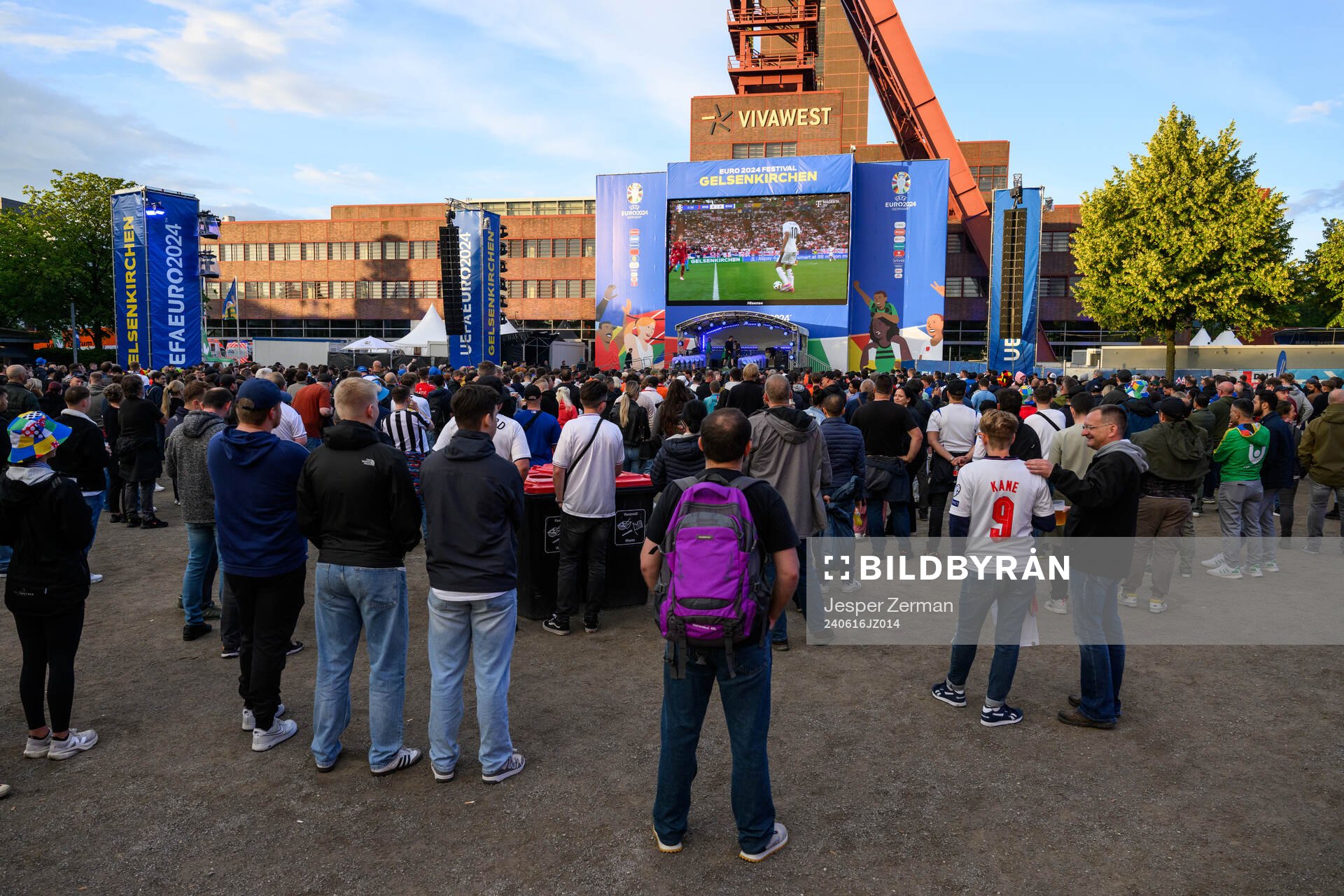 Fans watch the match between Engöand and Serbia in