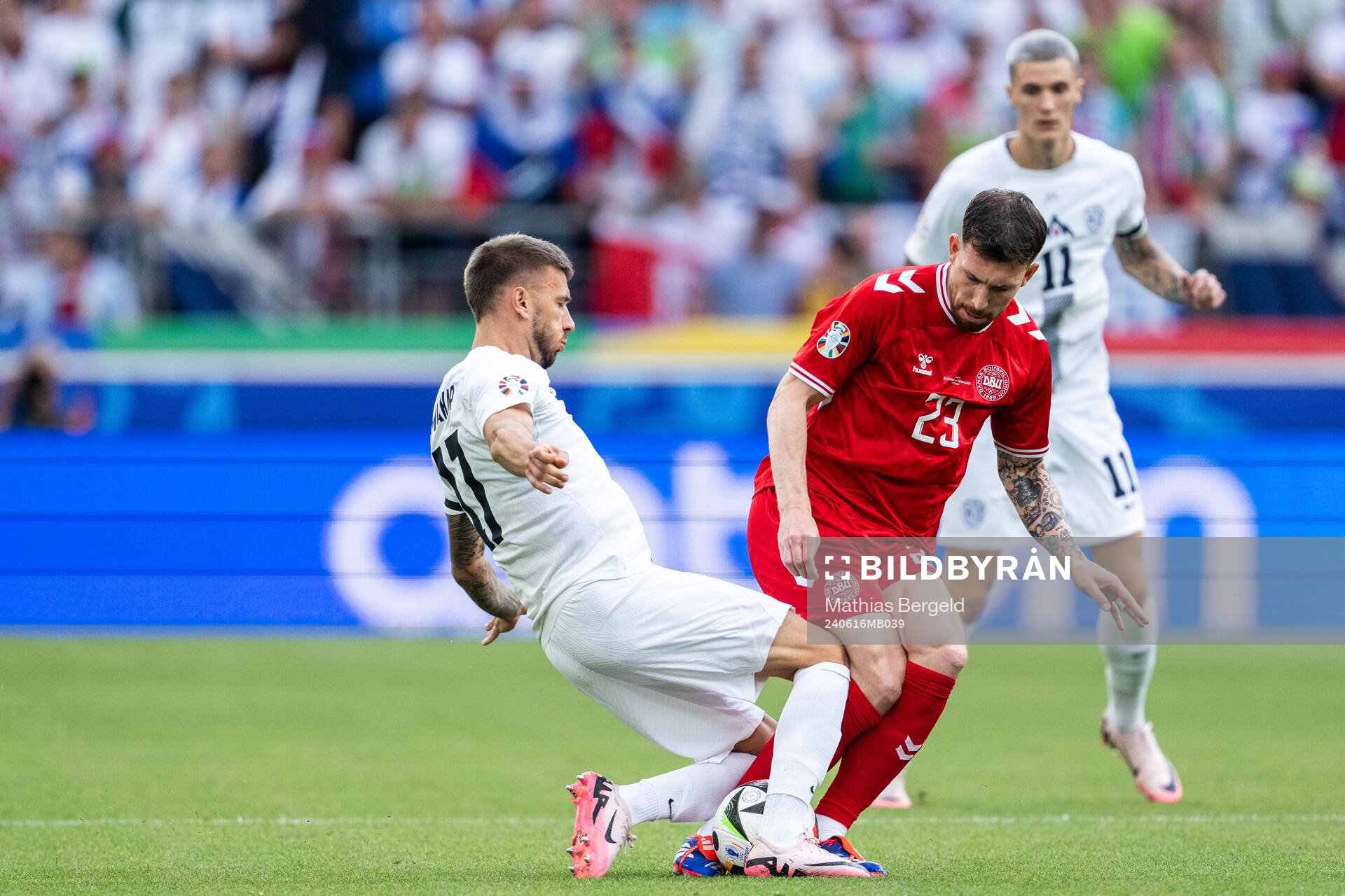 Jan Mlakar of Slovenia and Pierre-Emil Højberg of Denmark during the UEFA Euro 2024 Football Championship match between Slovenia and Denmark on June 16, 2024 in Stuttgart.