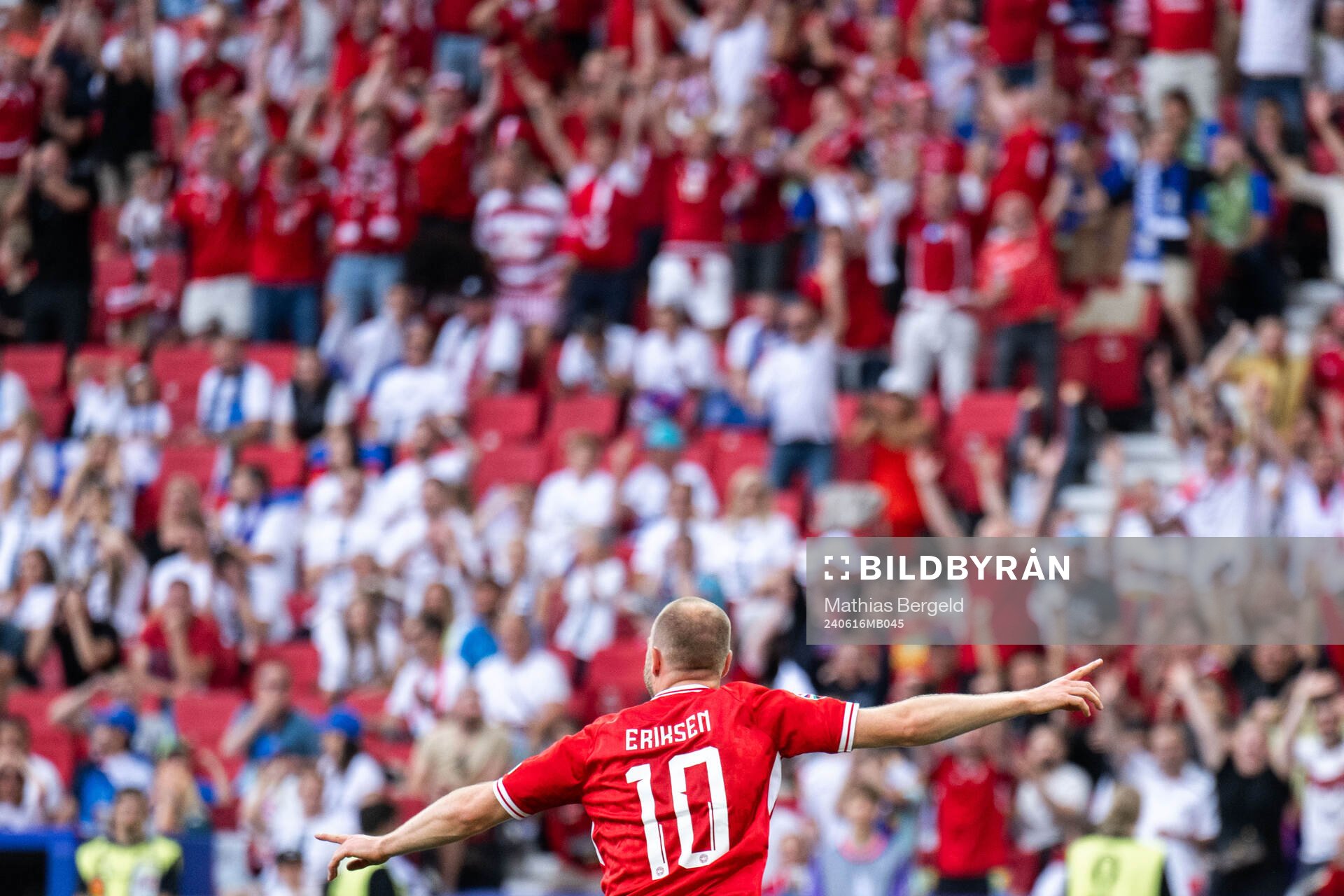 Christian Eriksen of Denmark celebrates