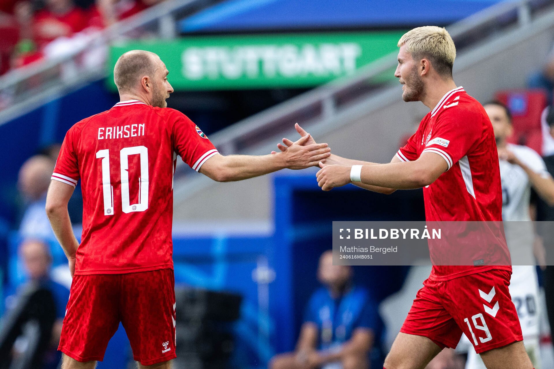 Christian Eriksen of Denmark celebrates with Jonas Wind after 0-1 during the UEFA Euro 2024 Football Championship match between Slovenia and Denmark on June 16, 2024 in Stuttgart.