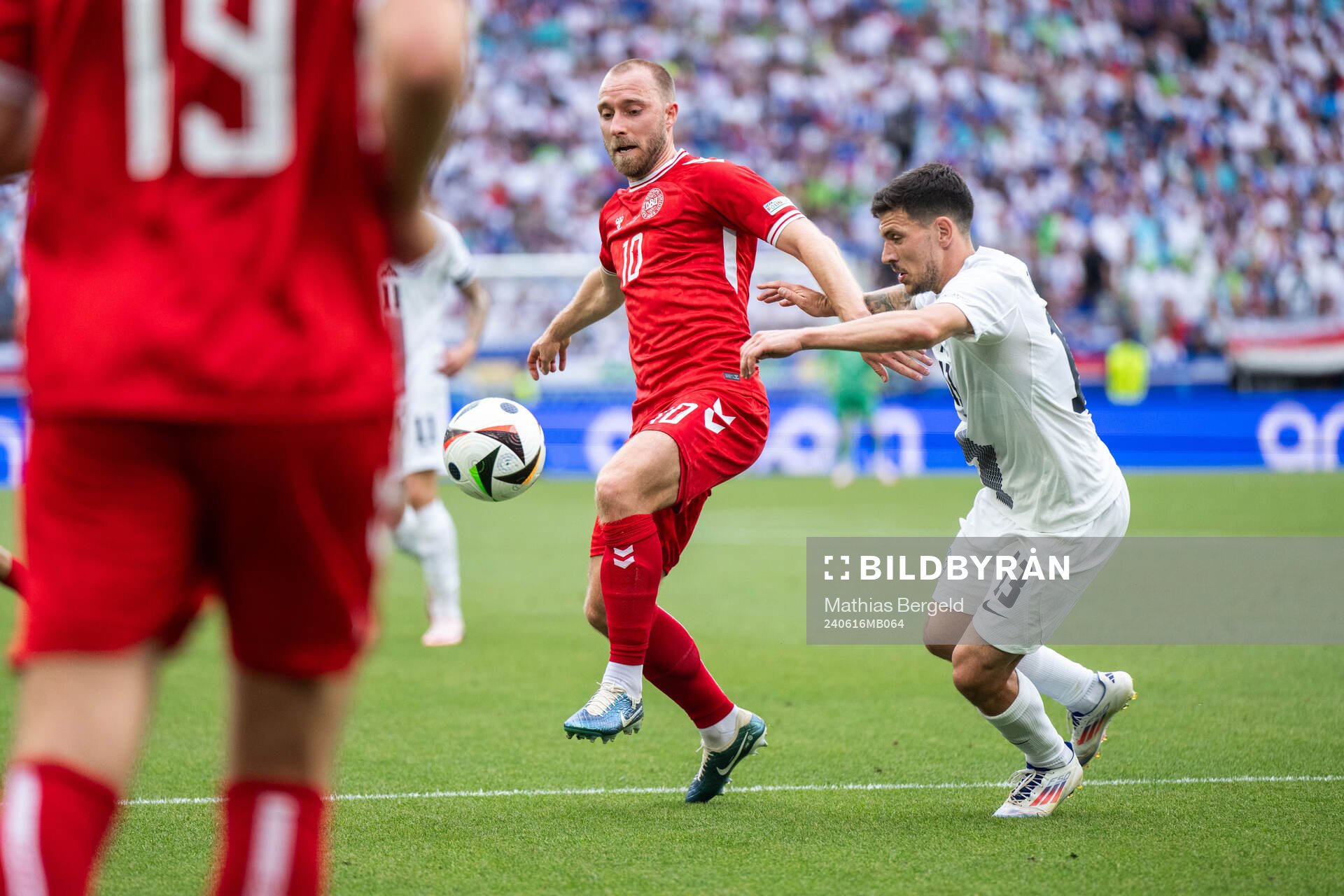 Christian Eriksen of Denmark and Erik Janza of Slovenia