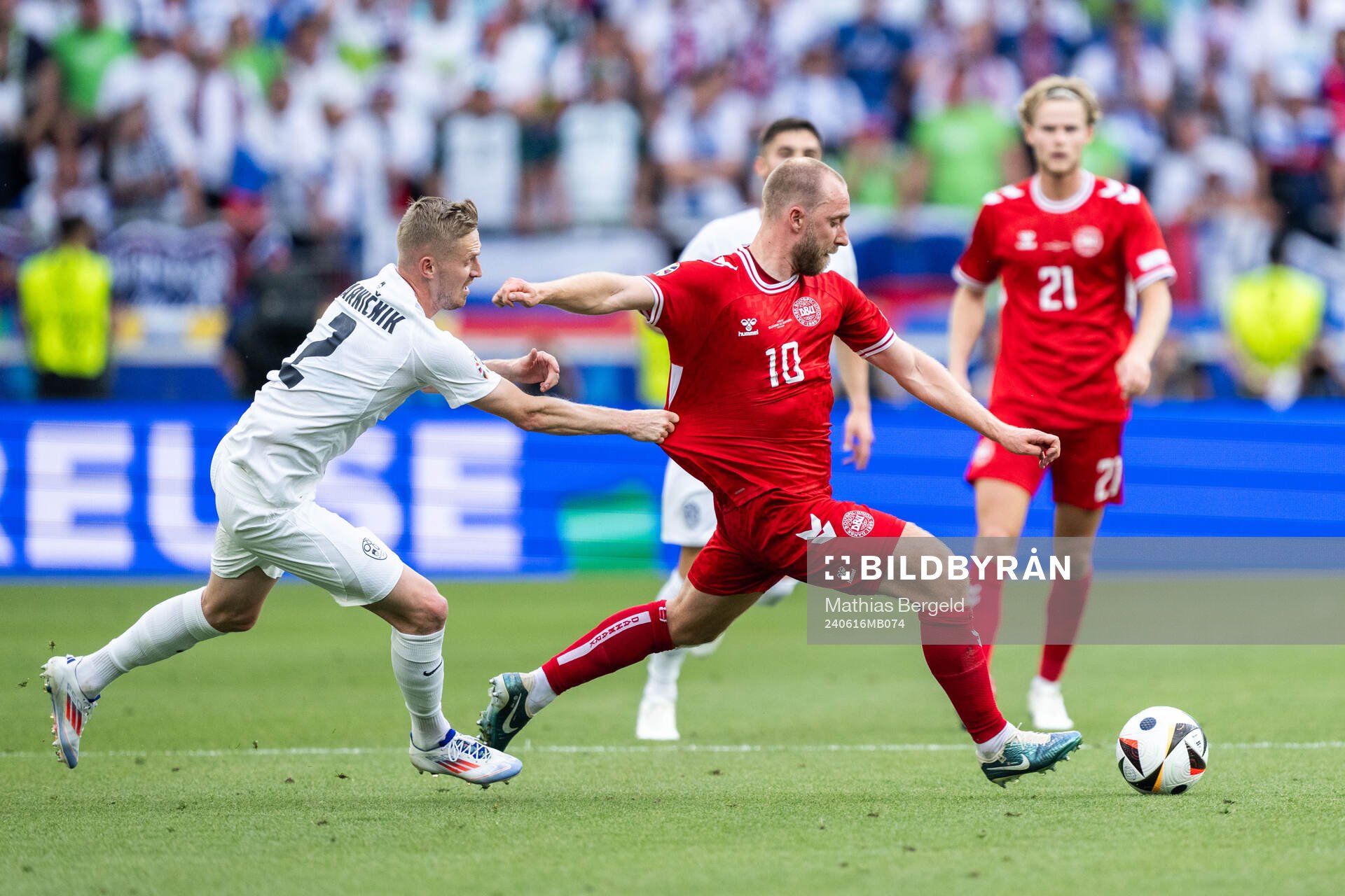 Zan Karnicnik of Slovenia and Christian Eriksen of Denmark during the UEFA Euro 2024 Football Championship match between Slovenia and Denmark on June 16, 2024 in Stuttgart. 