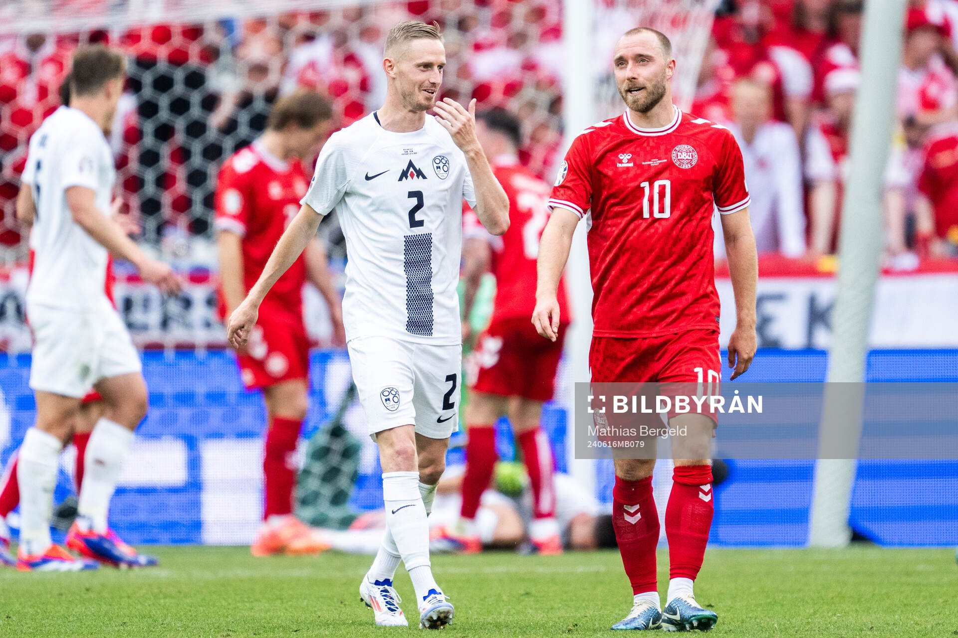Zan Karnicnik of Slovenia and Christian Eriksen of Denmark