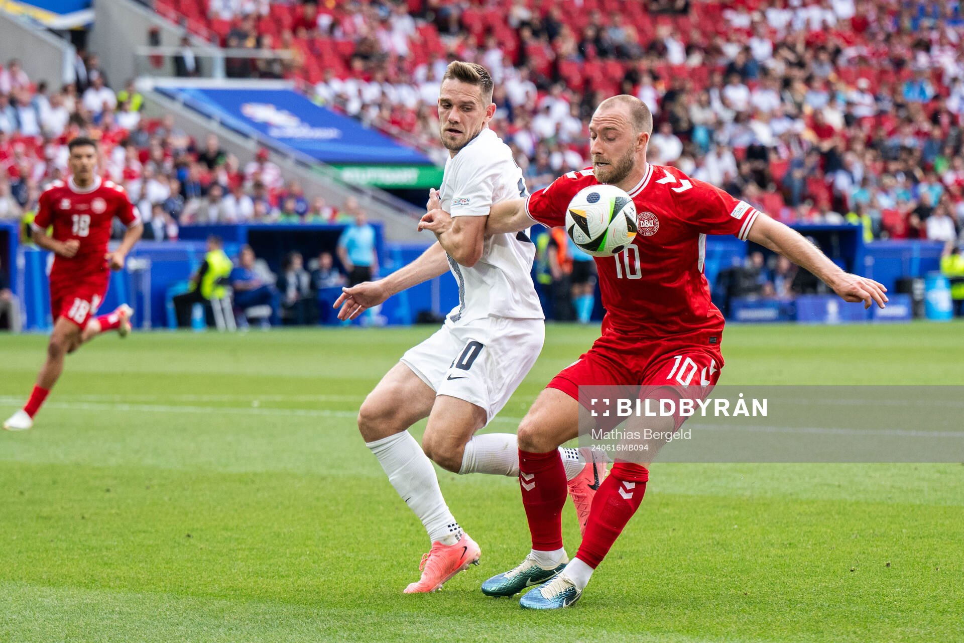 Timi Elsnik of Slovenia and Christian Eriksen of Denmark