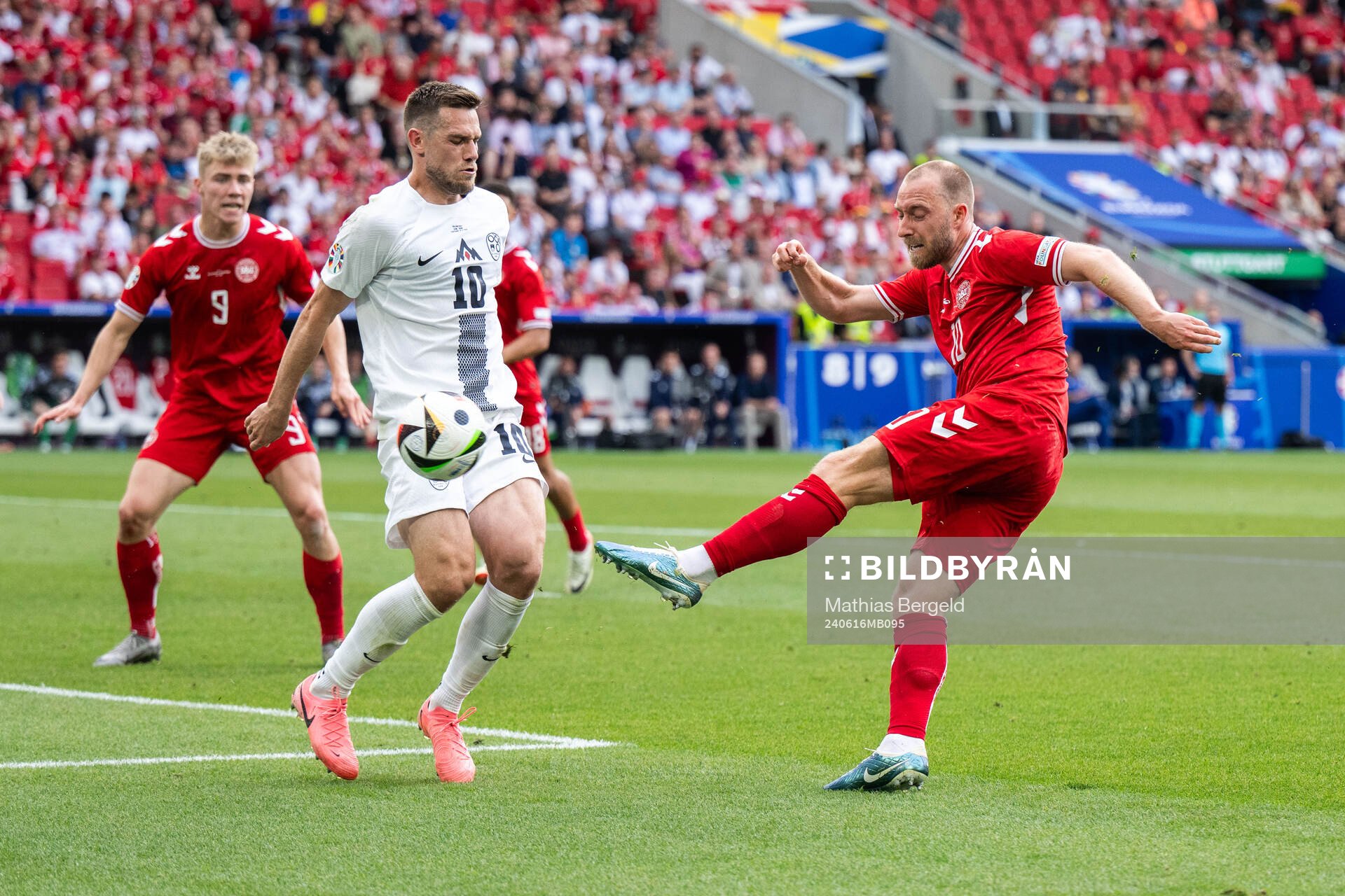 Timi Elsnik of Slovenia and Christian Eriksen of Denmark