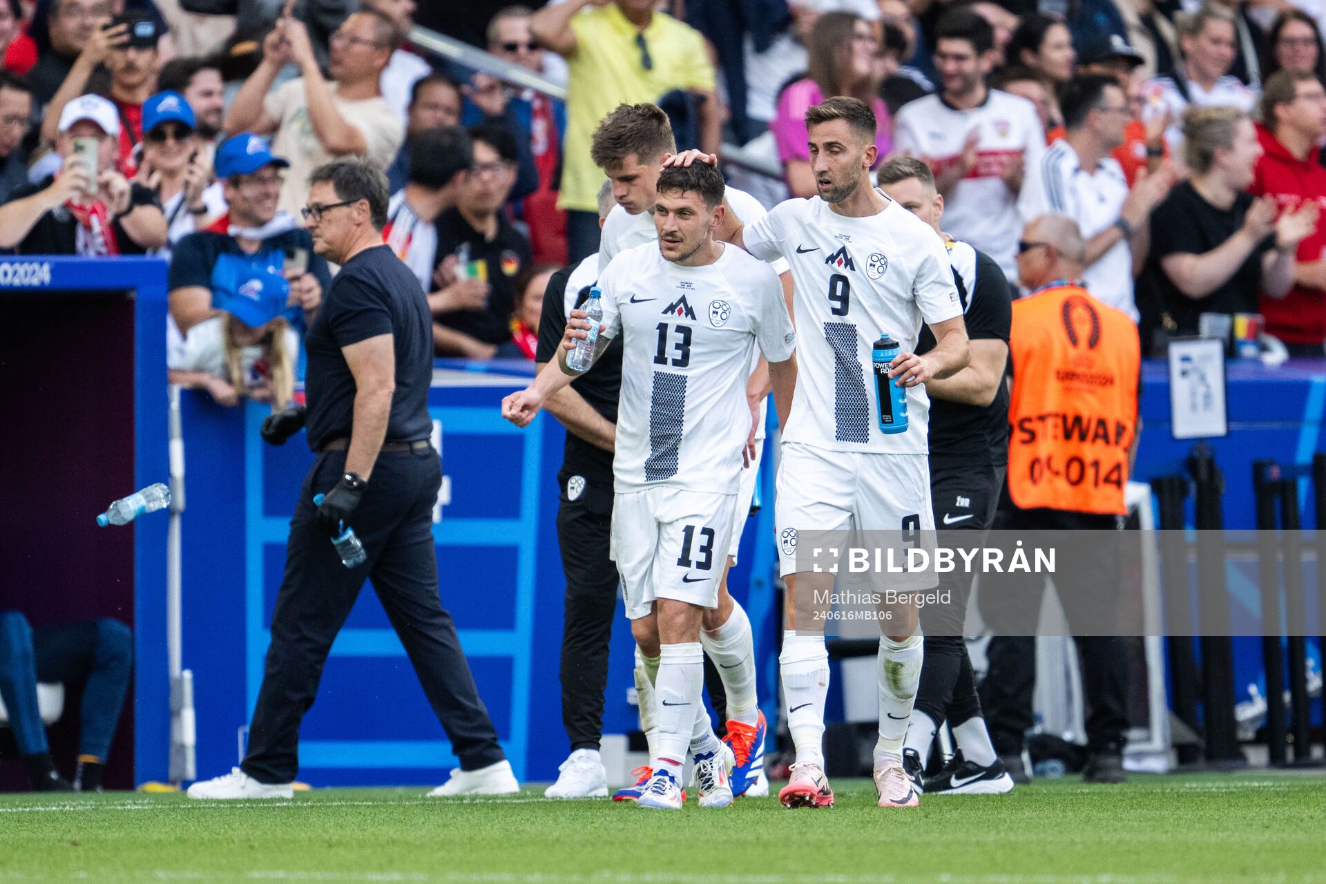 Erik Janza of Slovenia celebrates with Andraz Sporar