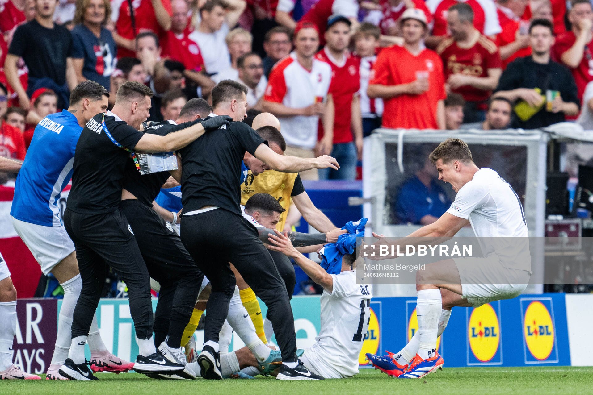 Erik Janza of Slovenia celebrates with team mates
