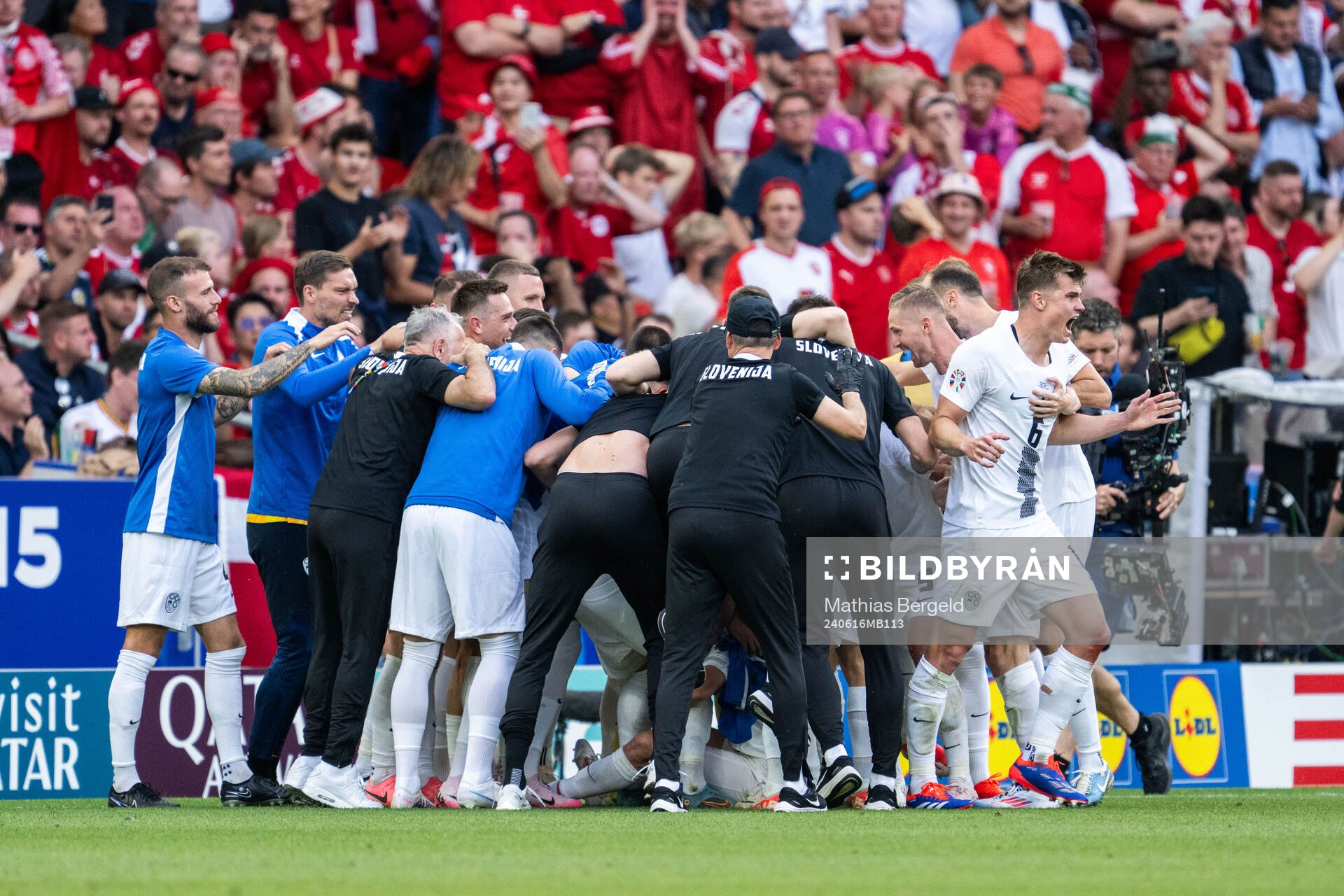 Erik Janza of Slovenia celebrates with team mates