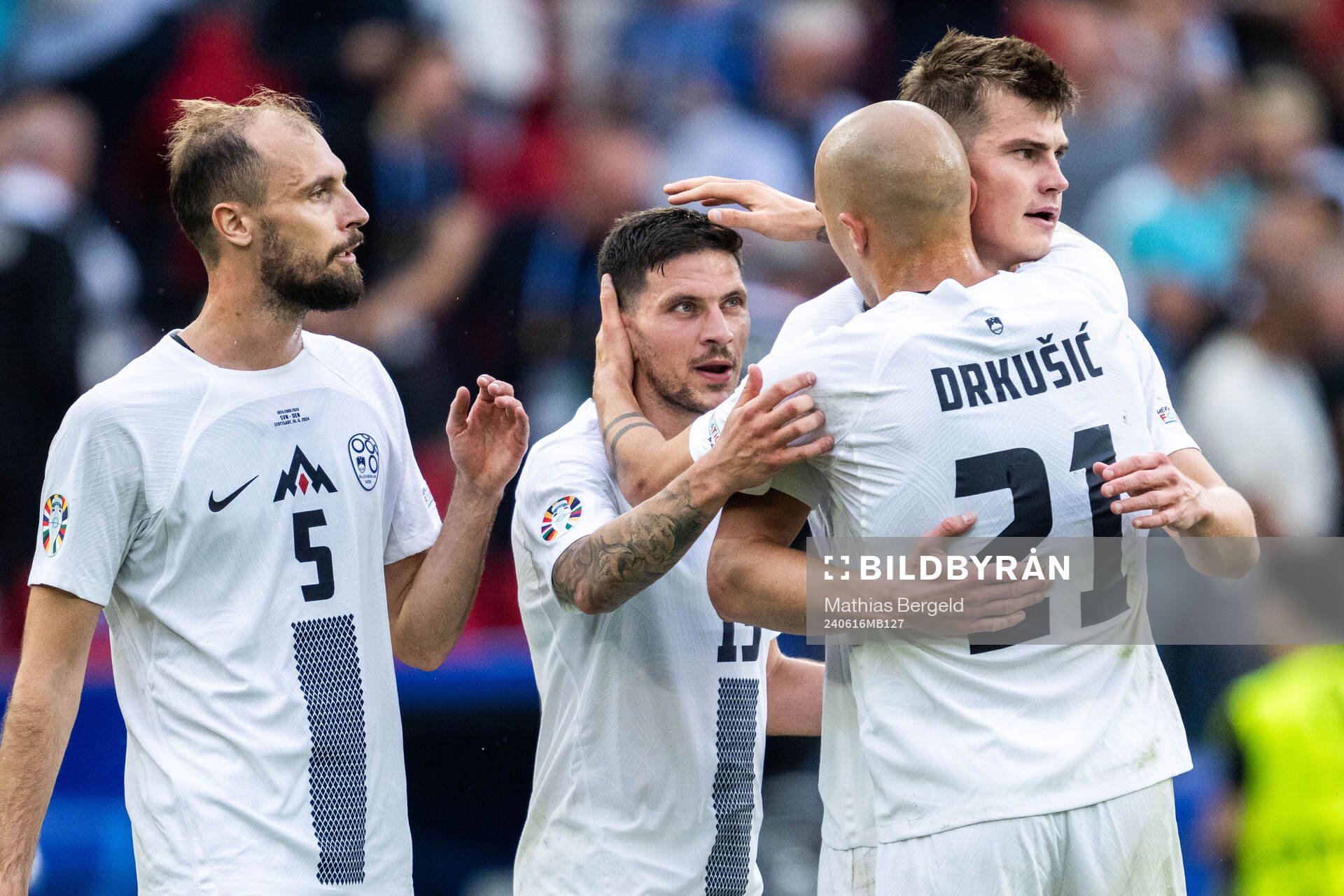 Jon Stankovic, Erik Janza, Jaka Bijol and Vanja Drkusic of Slovenia celebrate after the UEFA Euro 2024 Football Championship match between Slovenia and Denmark on June 16, 2024 in Stuttgart.