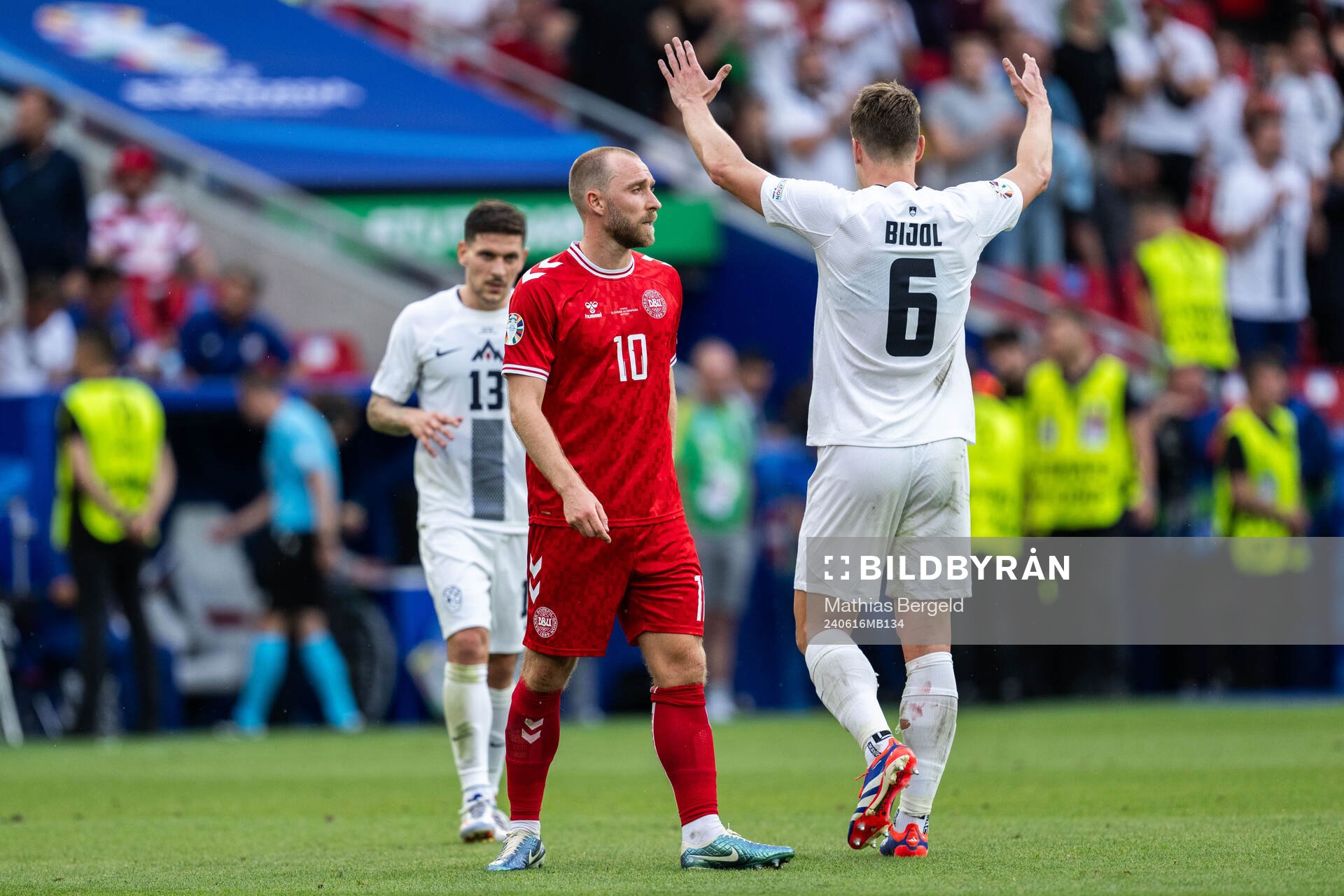 Christian Eriksen of Denmark looks dejected while Erik
