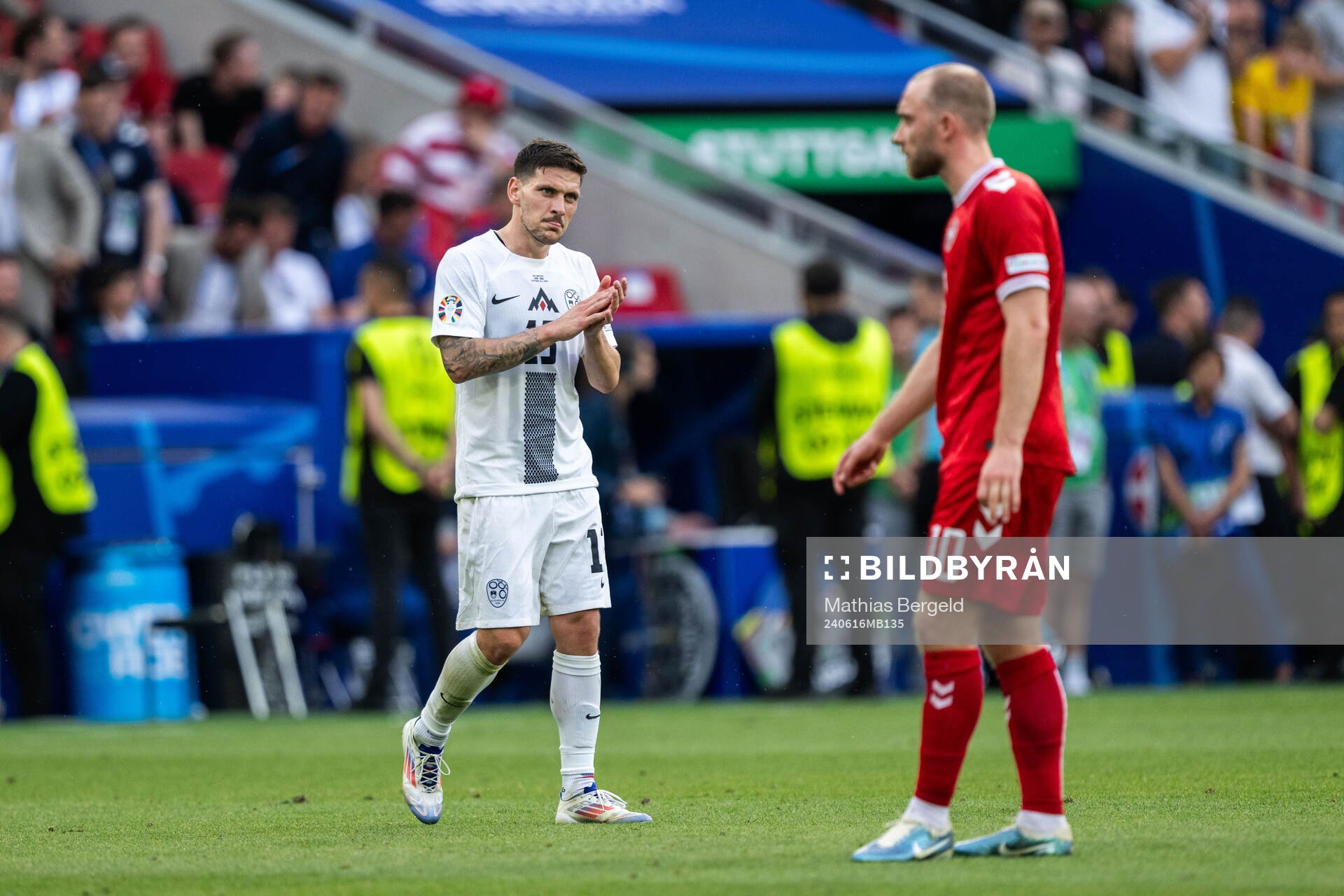 Erik Janza of Slovenia and Christian Eriksen of Denmark