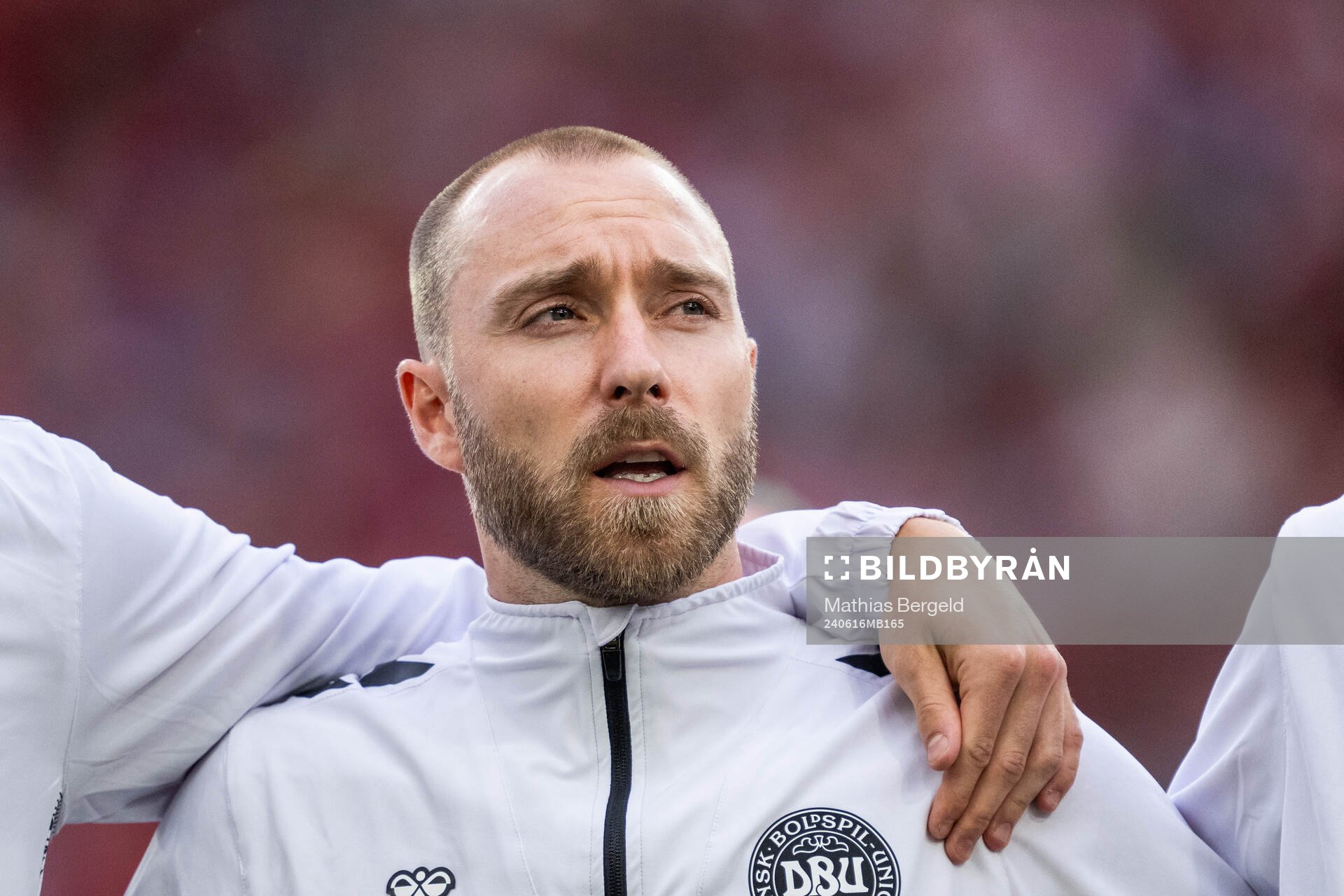 Christian Eriksen of Denmark sings the national anthem