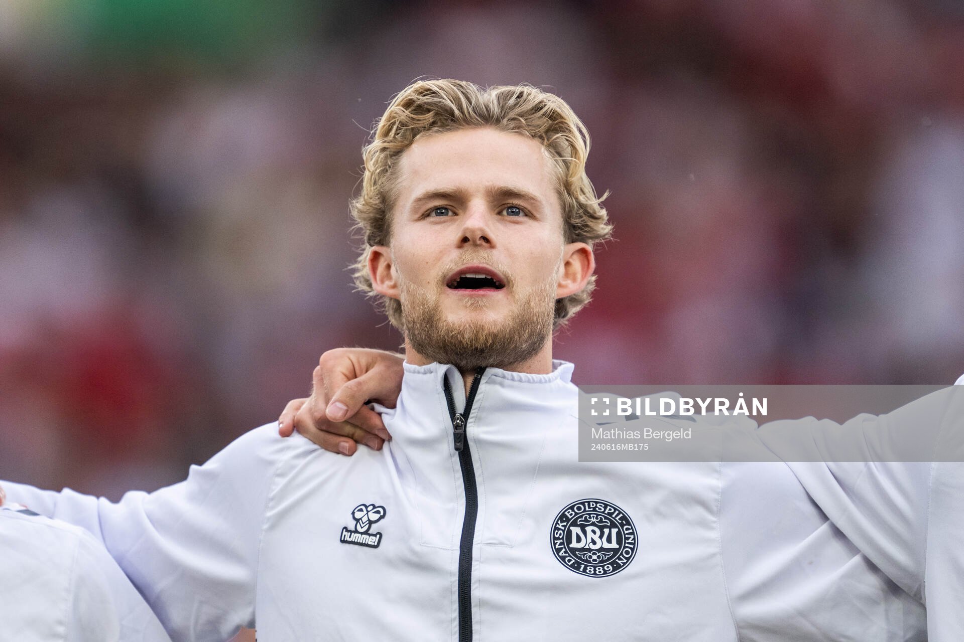 Morten Hjulmand of Denmark sings the national anthem