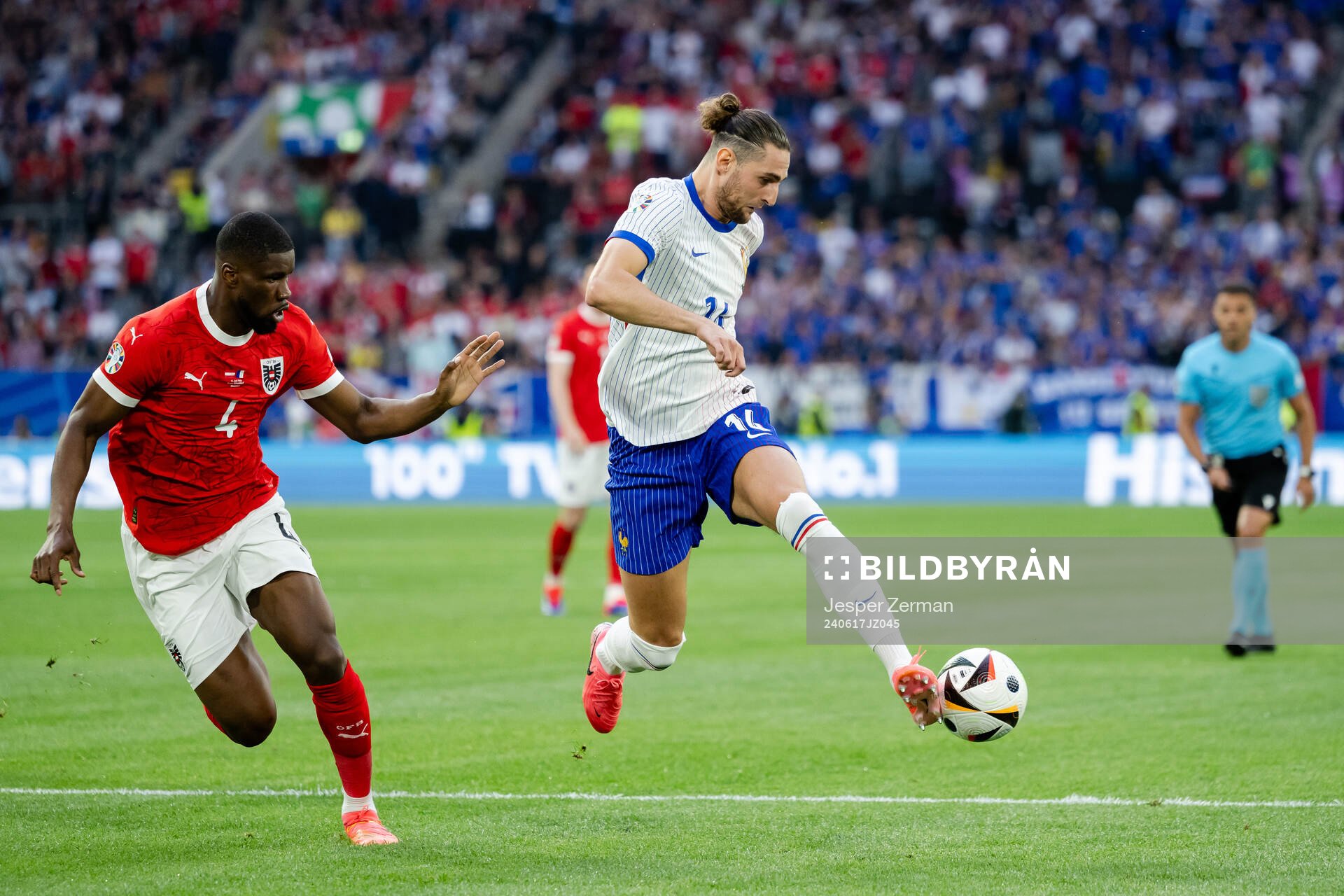 Kevin Danso of Austria and Adrien Rabiot of France