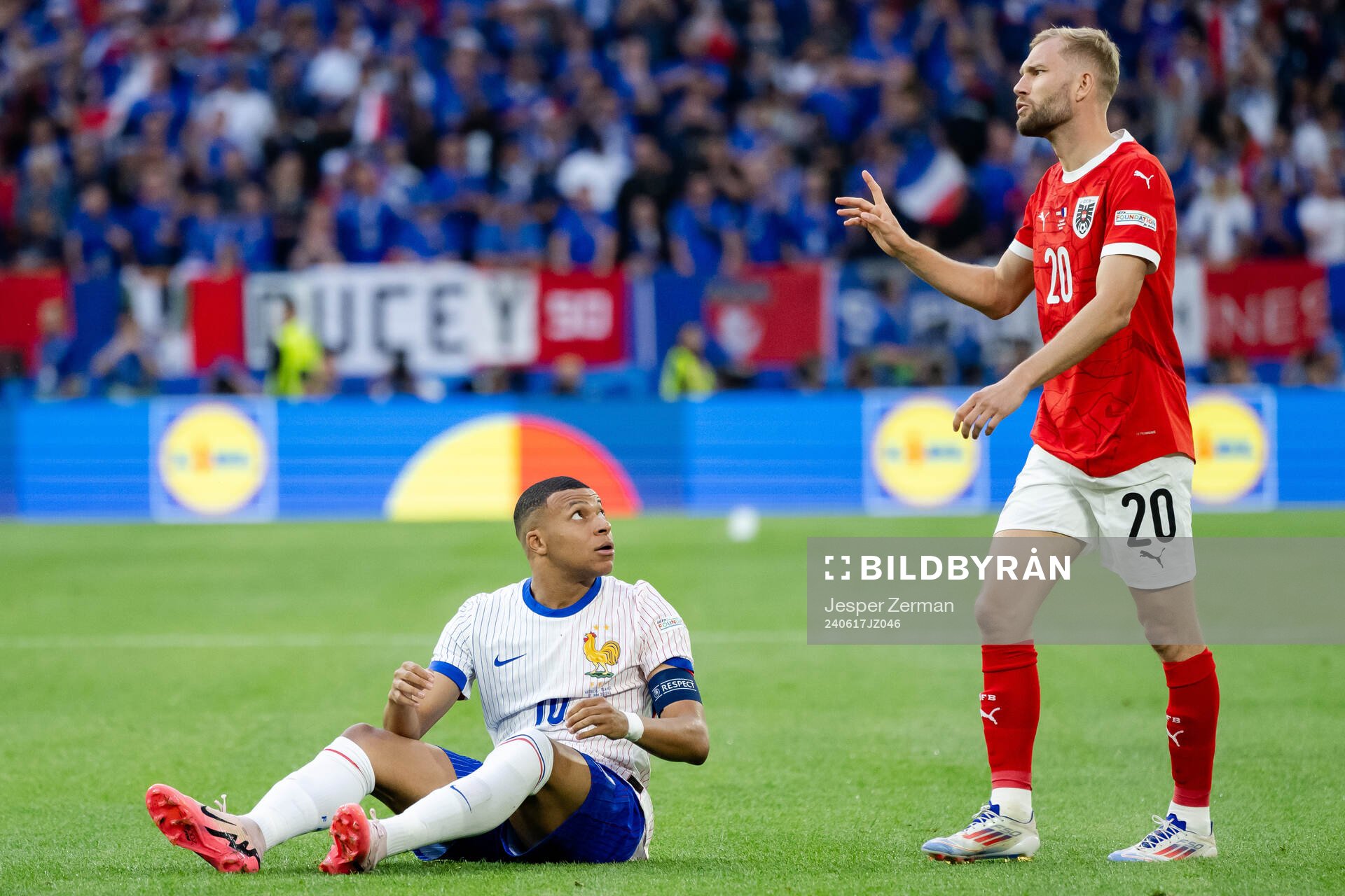 Kylian Mbappé of France and Konrad Laimer of Austria
