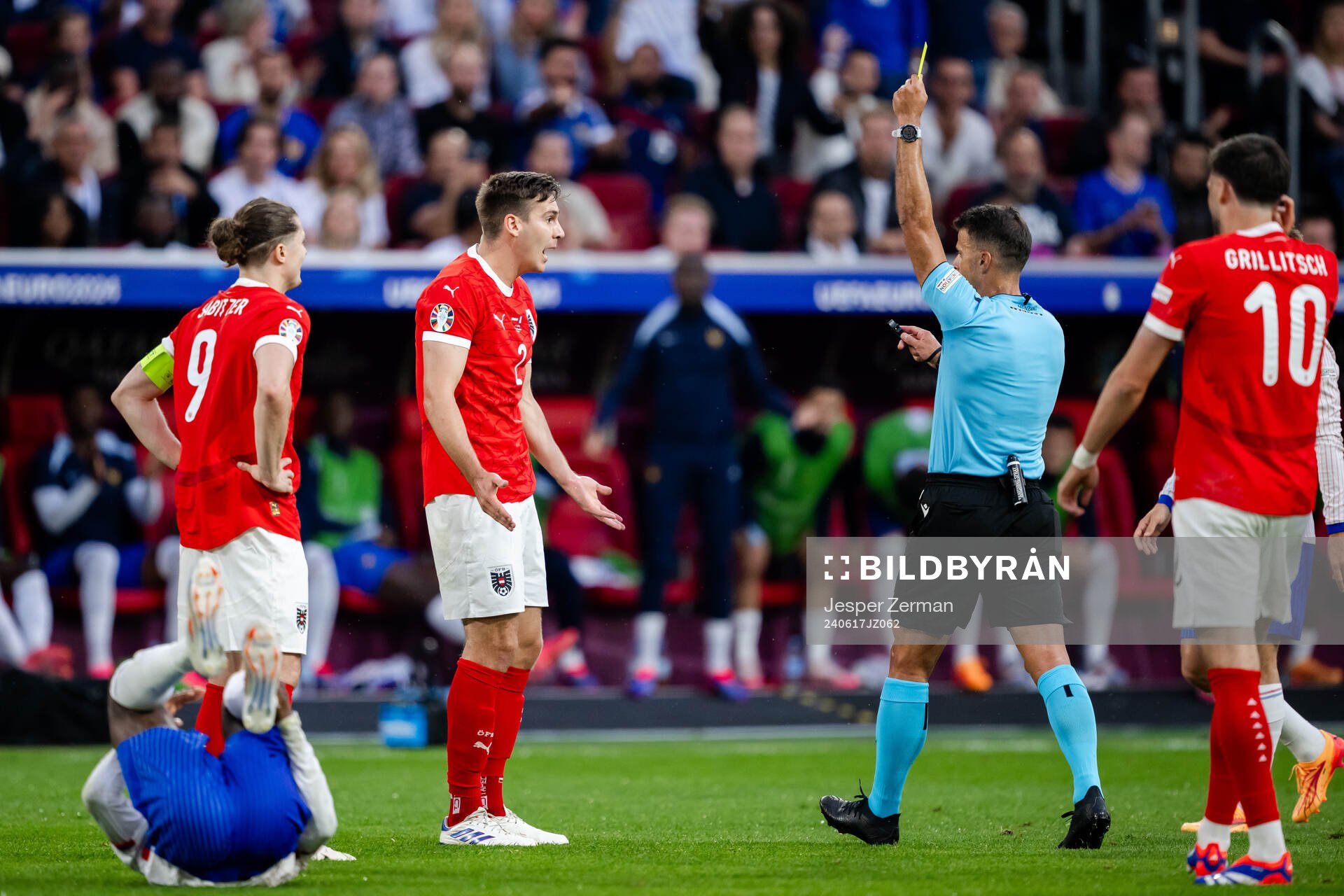 Maximilian Wöber of Austria receives a yellow card